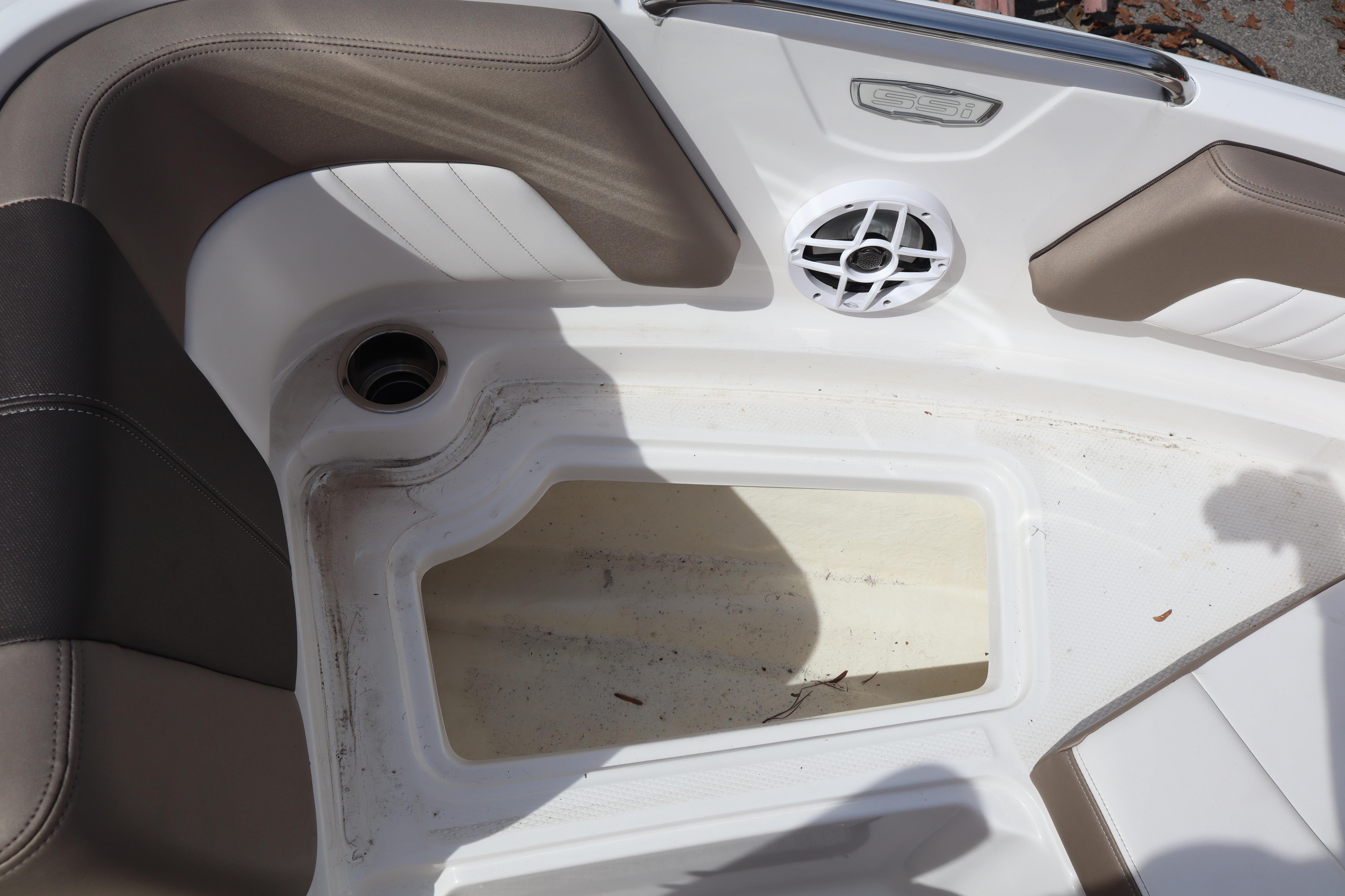 2021 Chaparral 21 SSi boat interior with seating and speaker detail.