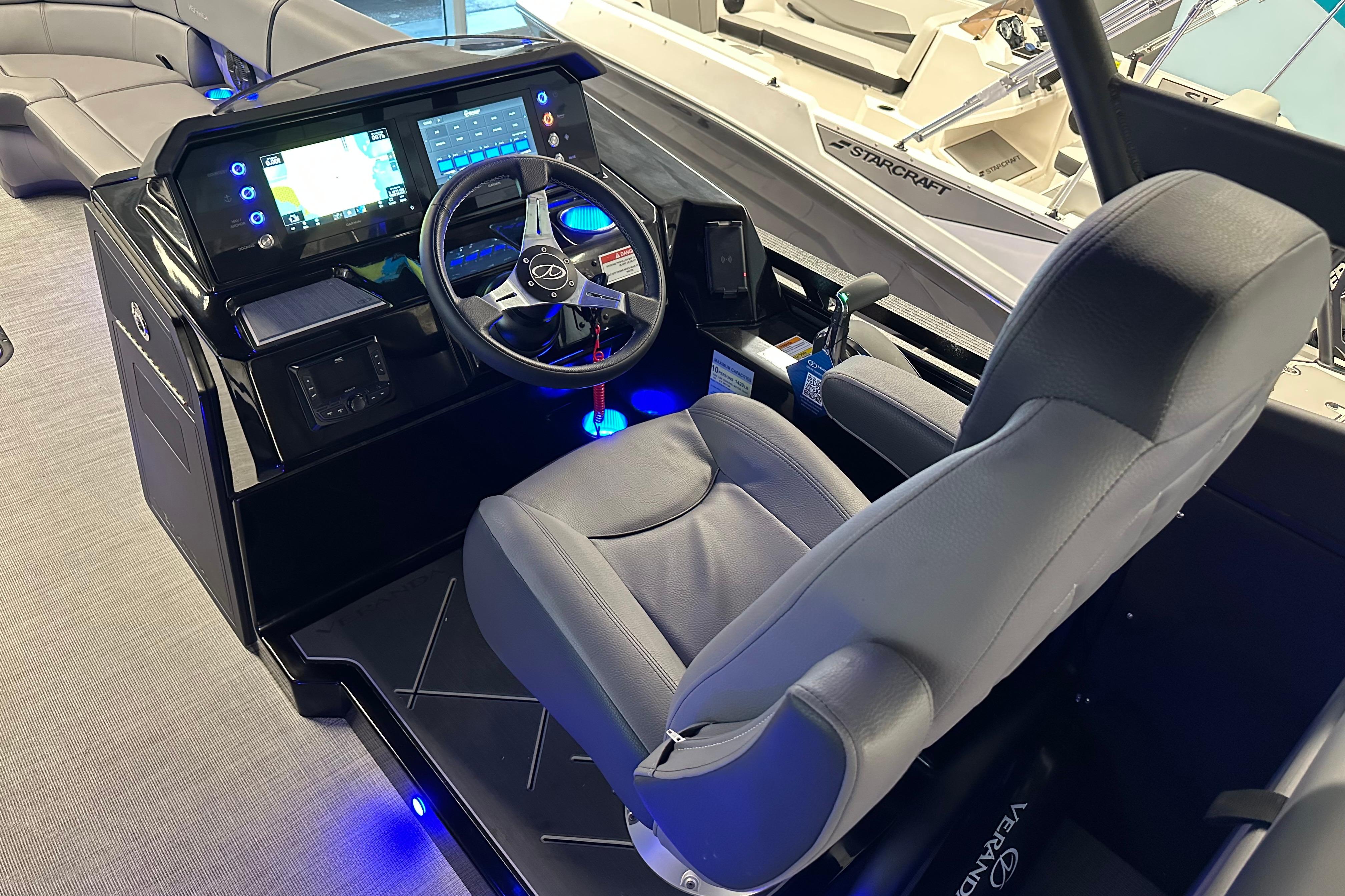 2025 Veranda VX 27 DCRC boat cockpit with modern steering and digital controls.
