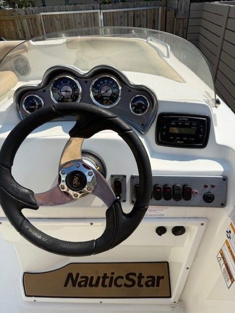 2020 Nautic 203SC boat helm with gauges and controls.