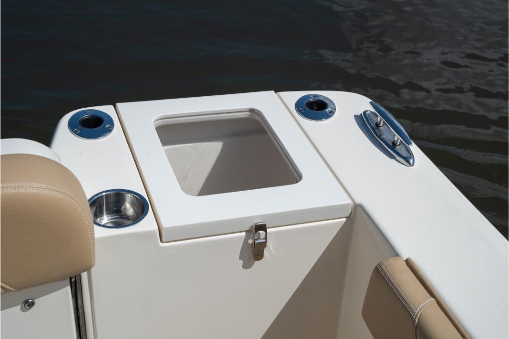 2023 Scout 240 Dorado boat interior with cup holders and storage compartment.