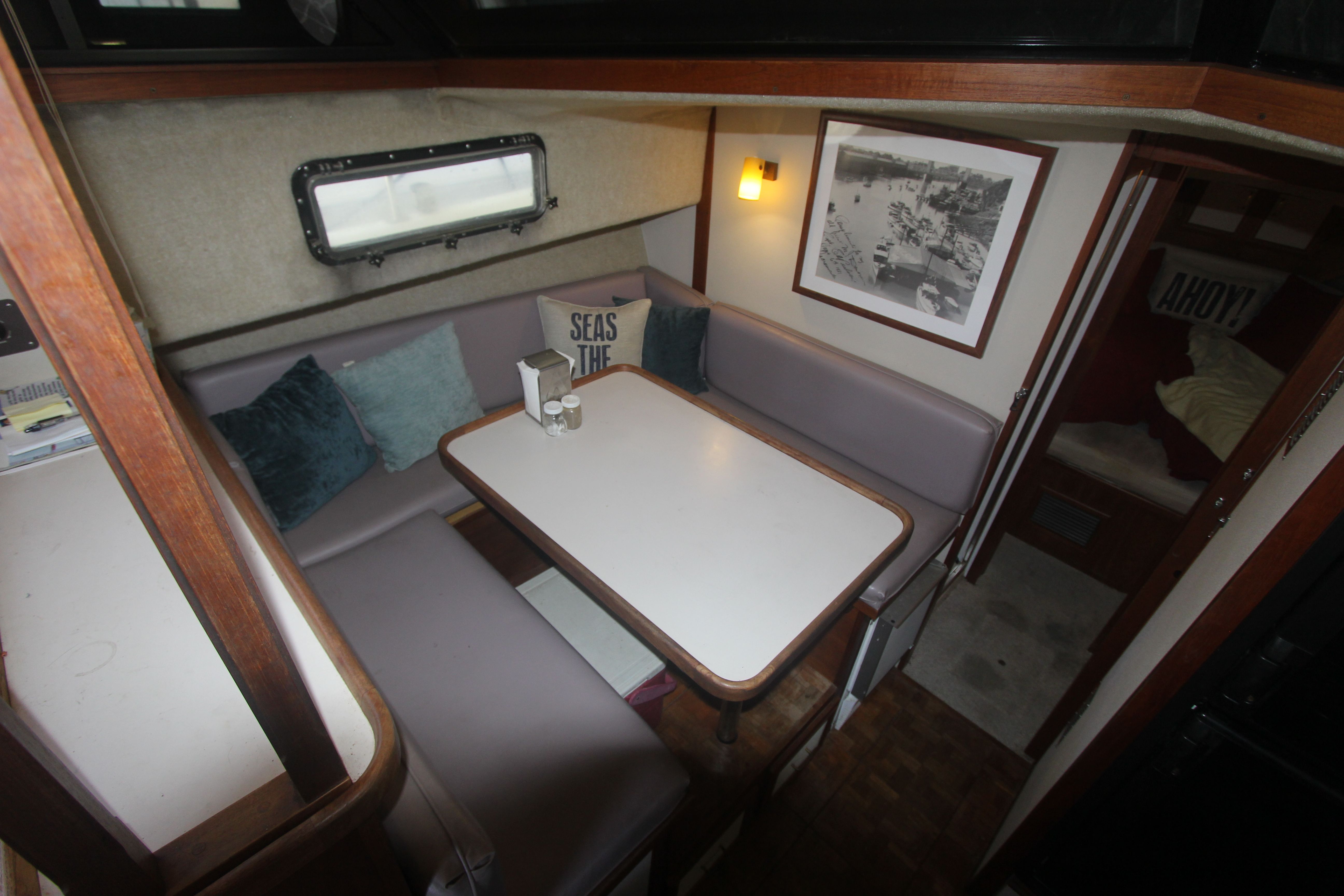 Interior of the 1988 Carver 3607 Aft Cabin Motor Yacht with a cozy seating area.