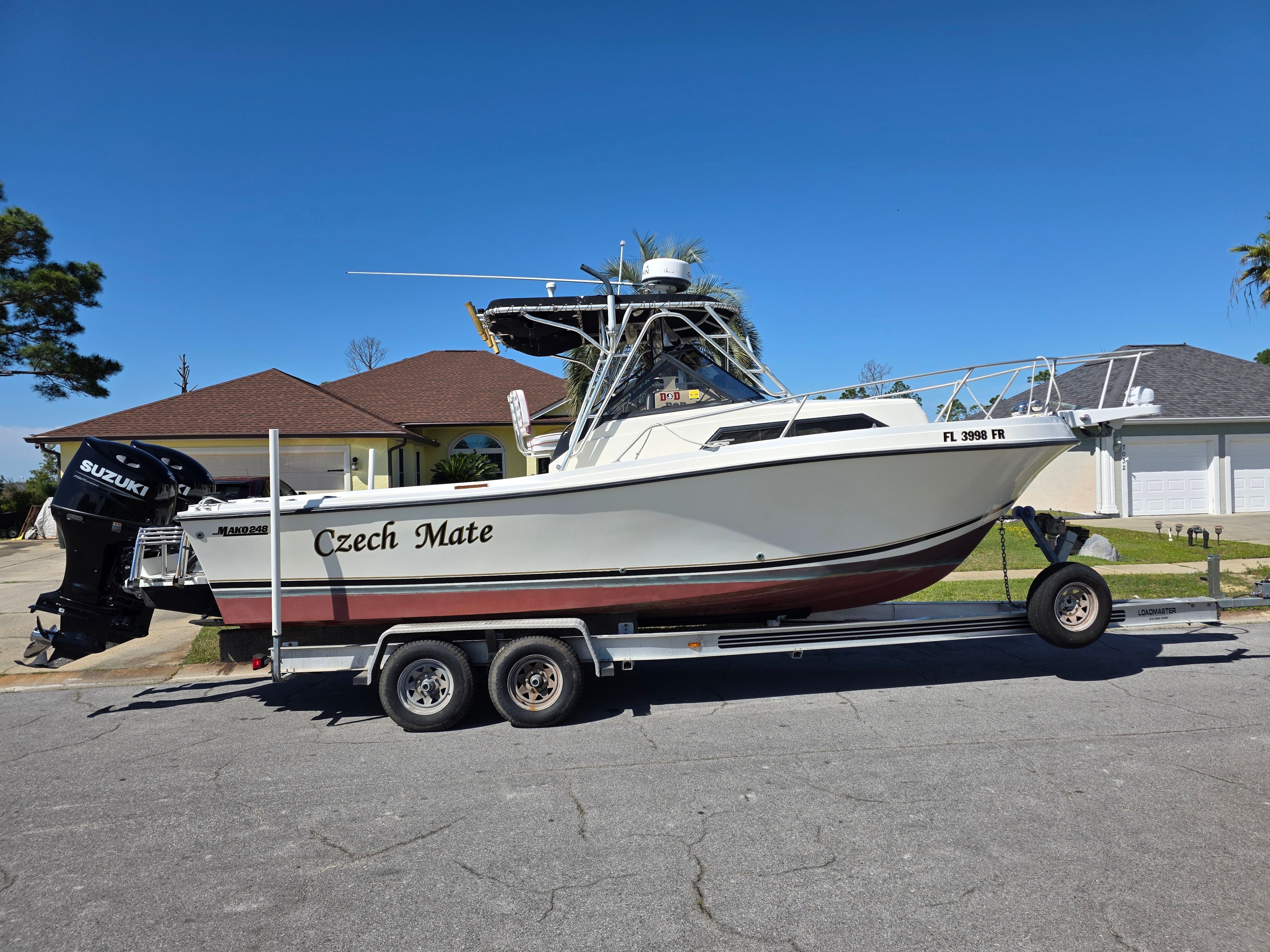 1987 Mako 248 WAC boat on trailer, Suzuki engine.