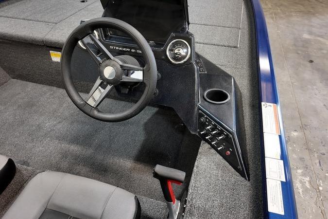 2024 Lowe Stinger 198 boat cockpit with steering wheel and control panel.