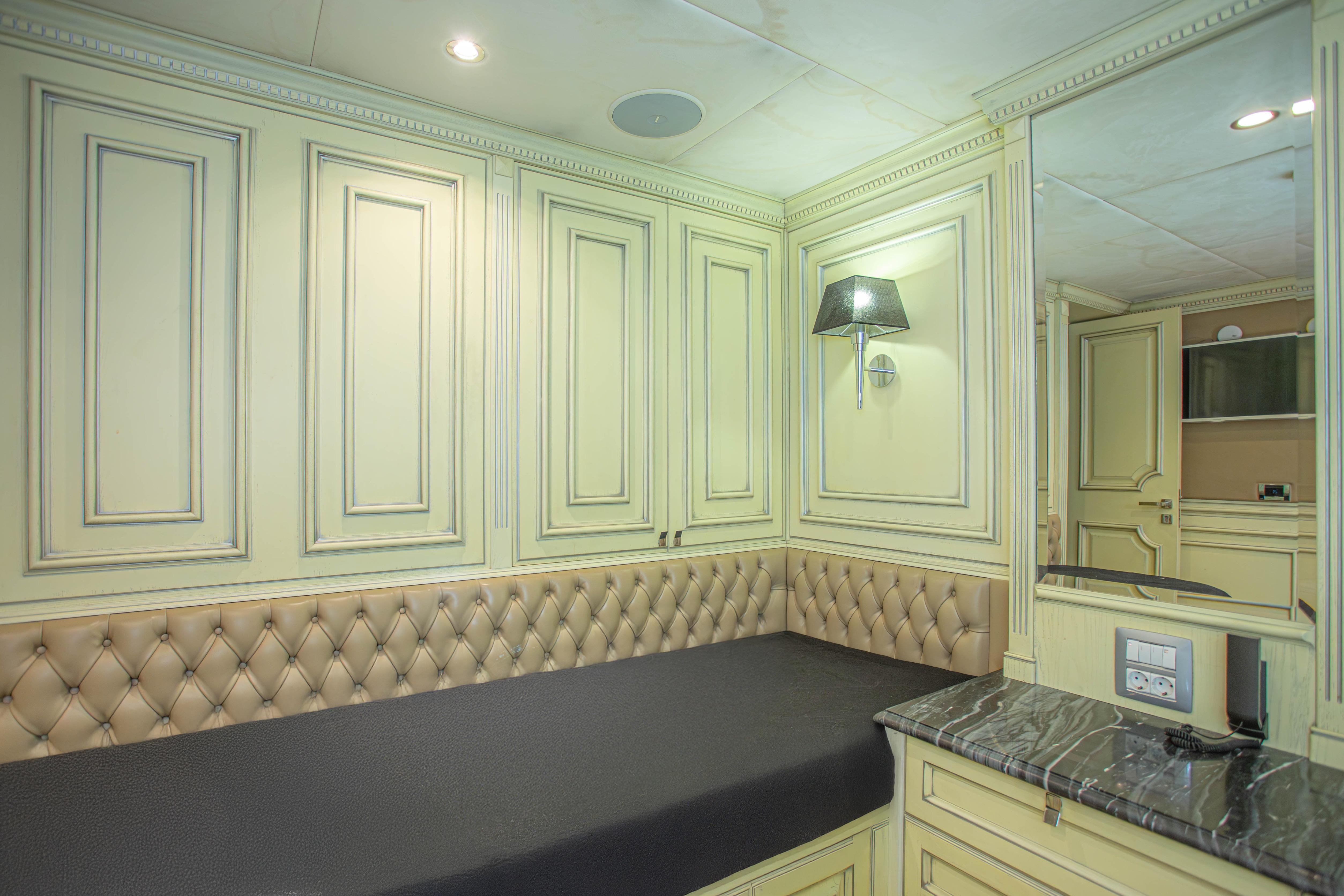 Luxurious interior of 2014 Fifth Ocean Yachts 24m Explorer Yacht with elegant paneling and plush seating.
