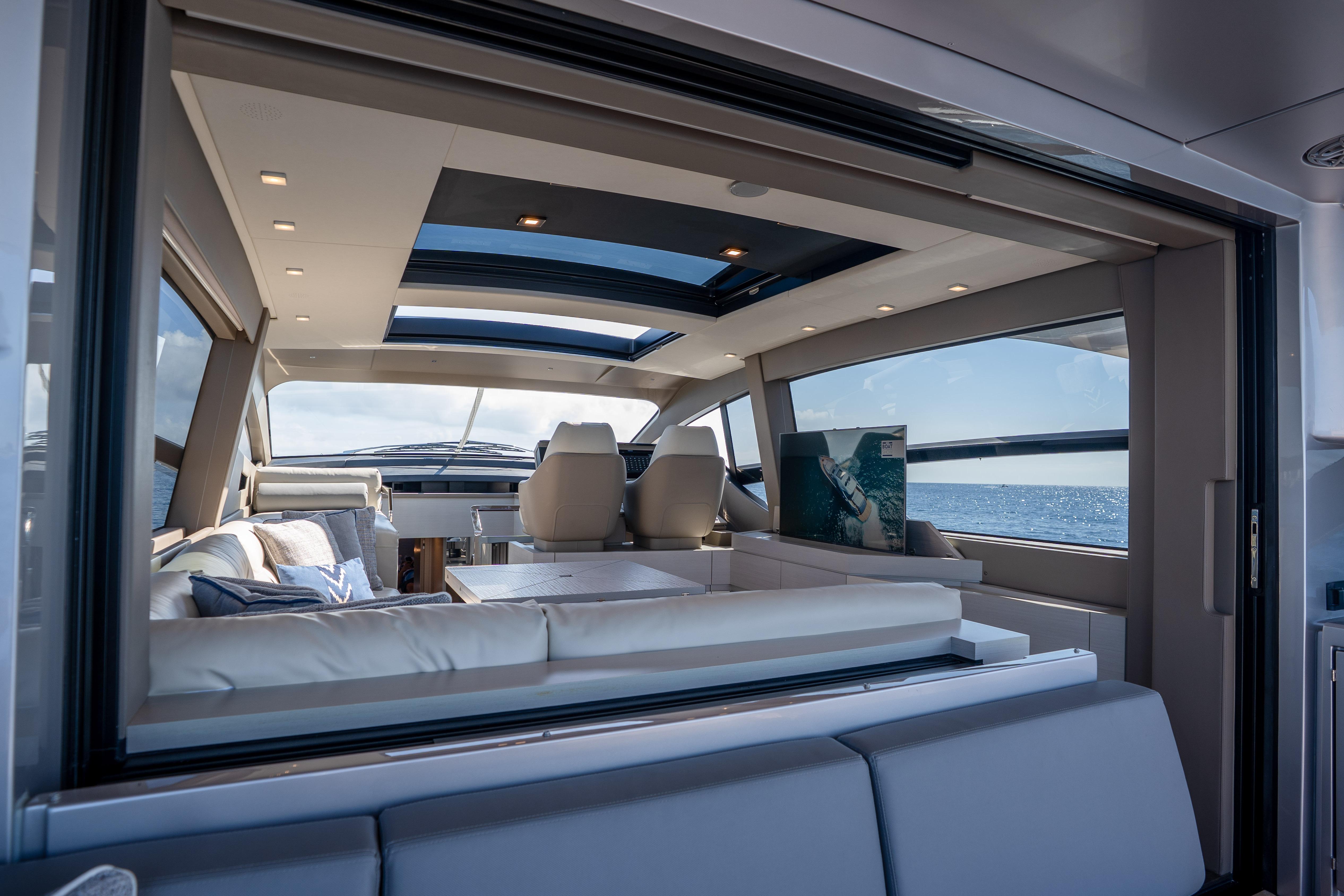 Luxurious interior of 2024 Pershing 7X yacht with ocean view and modern design.