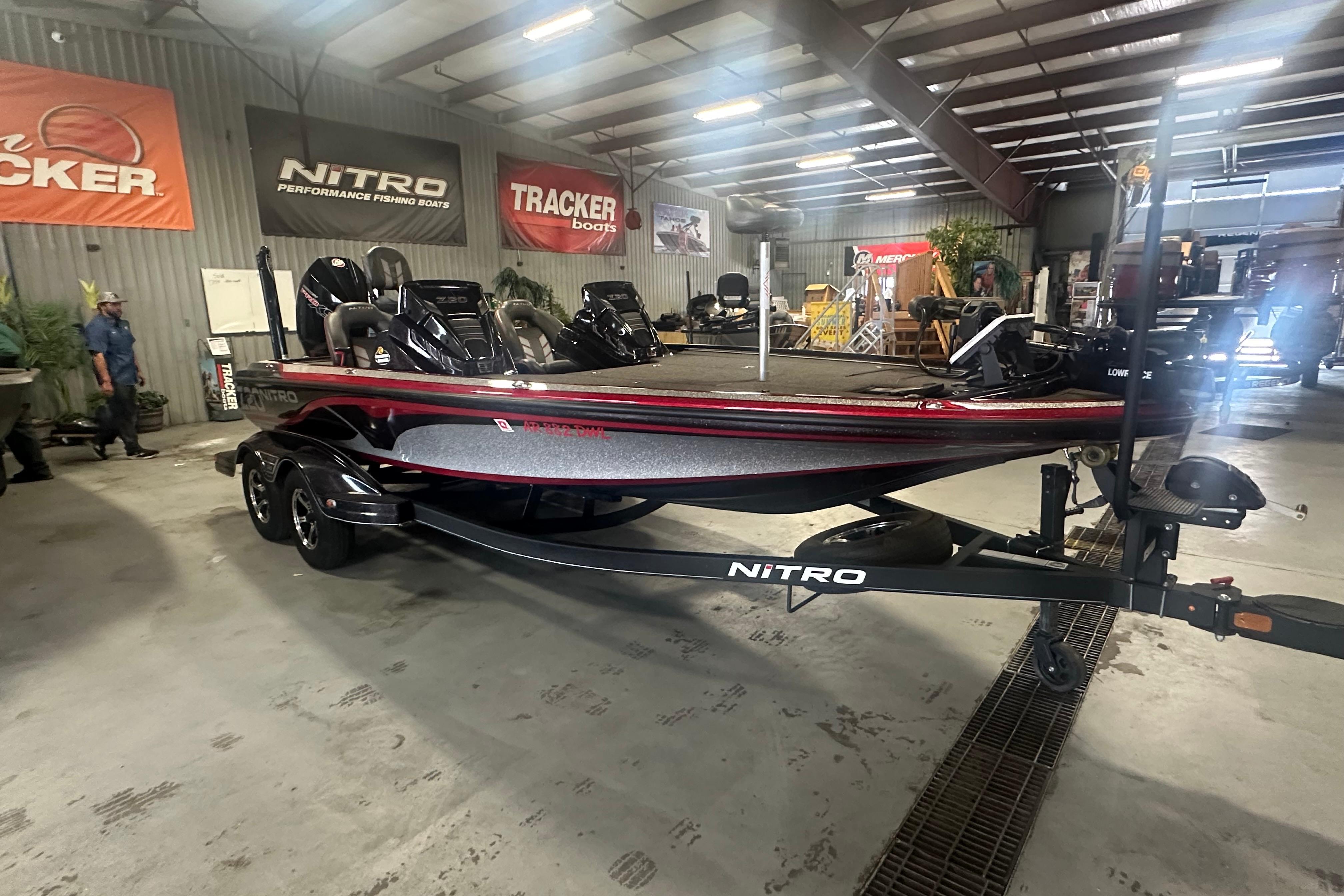 2022 Nitro Z20 Pro fishing boat displayed indoors with Tracker signage.