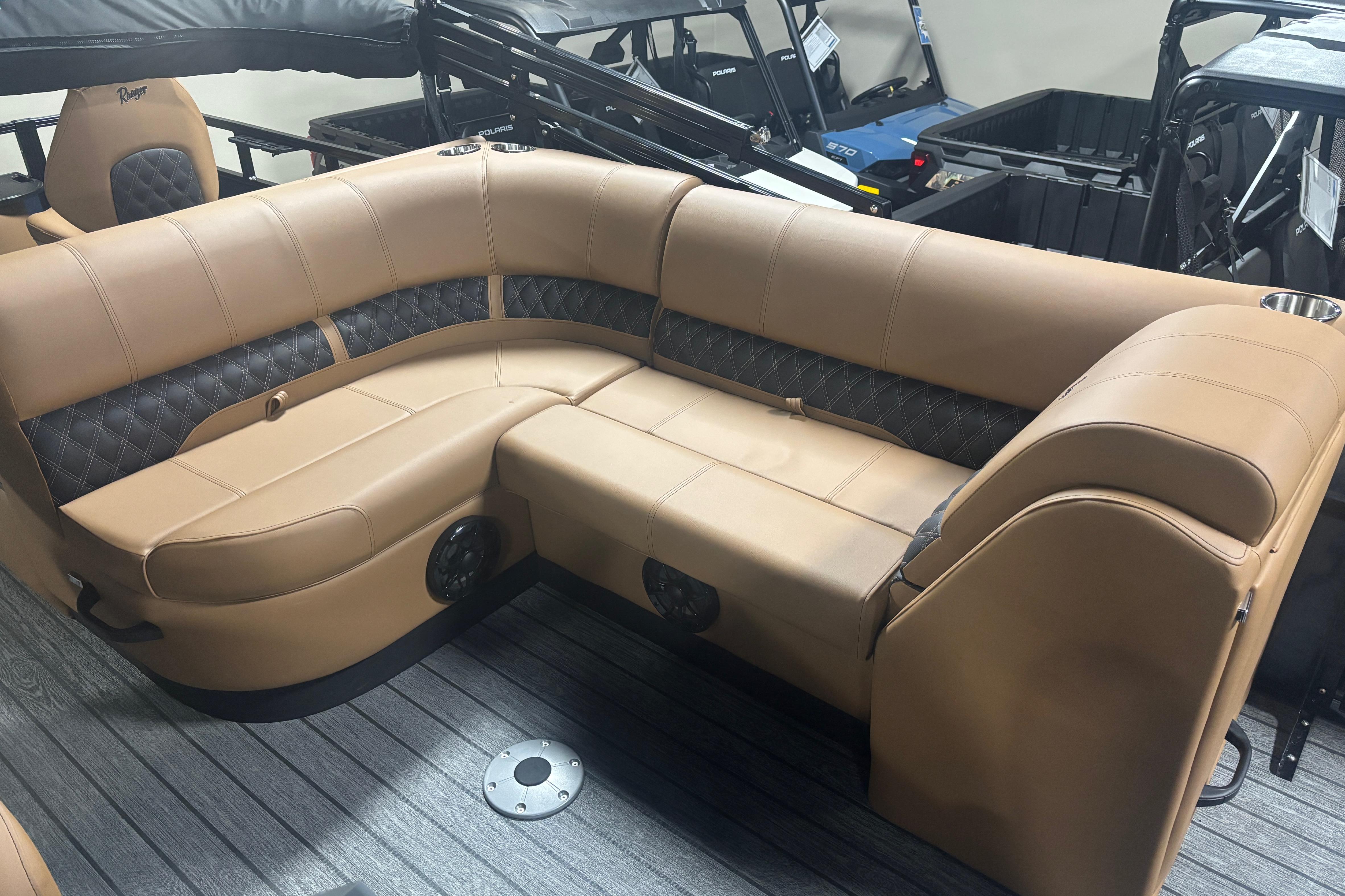 Luxurious seating in 2026 Ranger 223F boat, featuring tan upholstery and modern design.