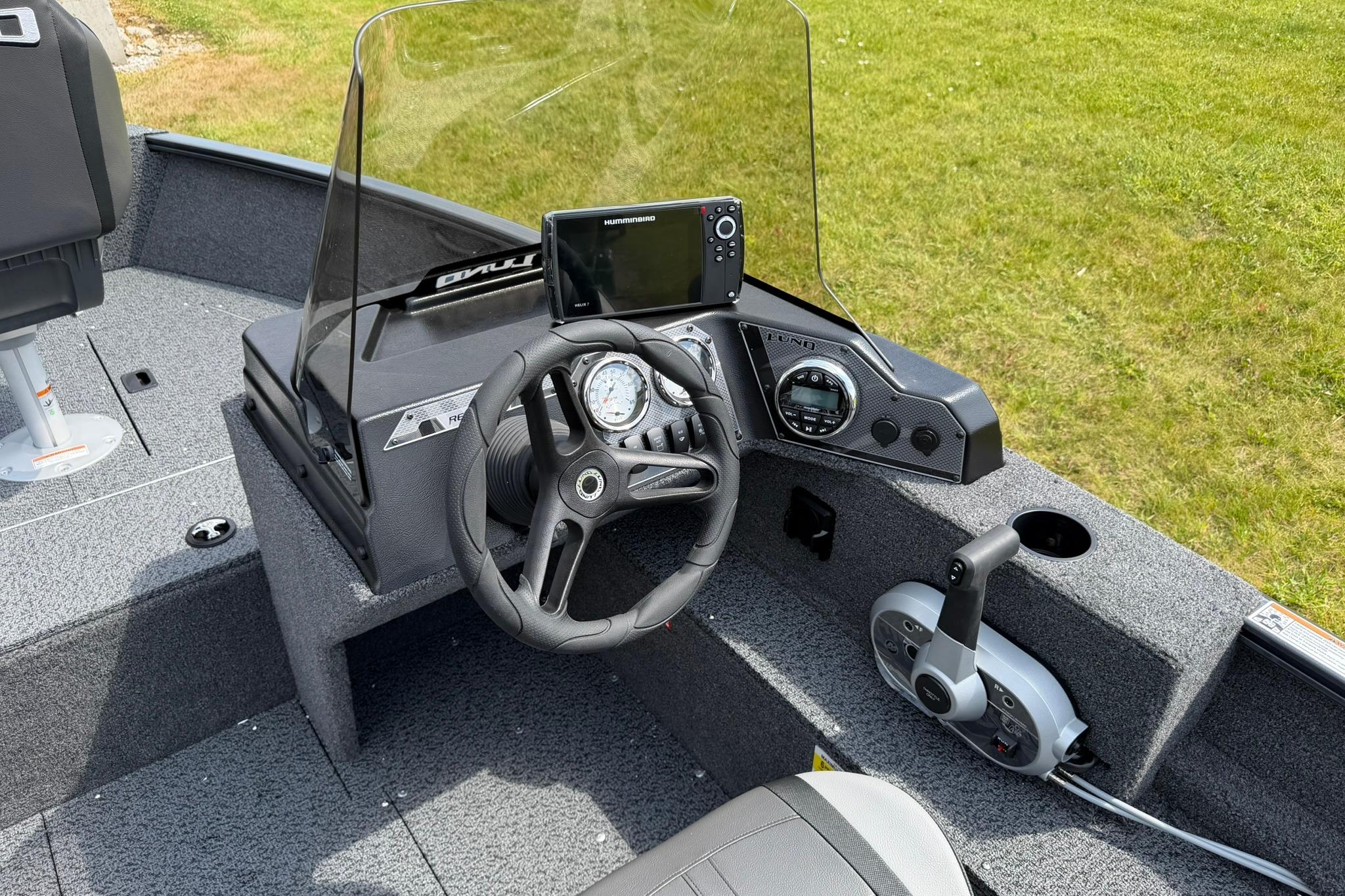 2027 Lund 1650 Rebel XL SS boat dashboard with steering wheel and navigation system.