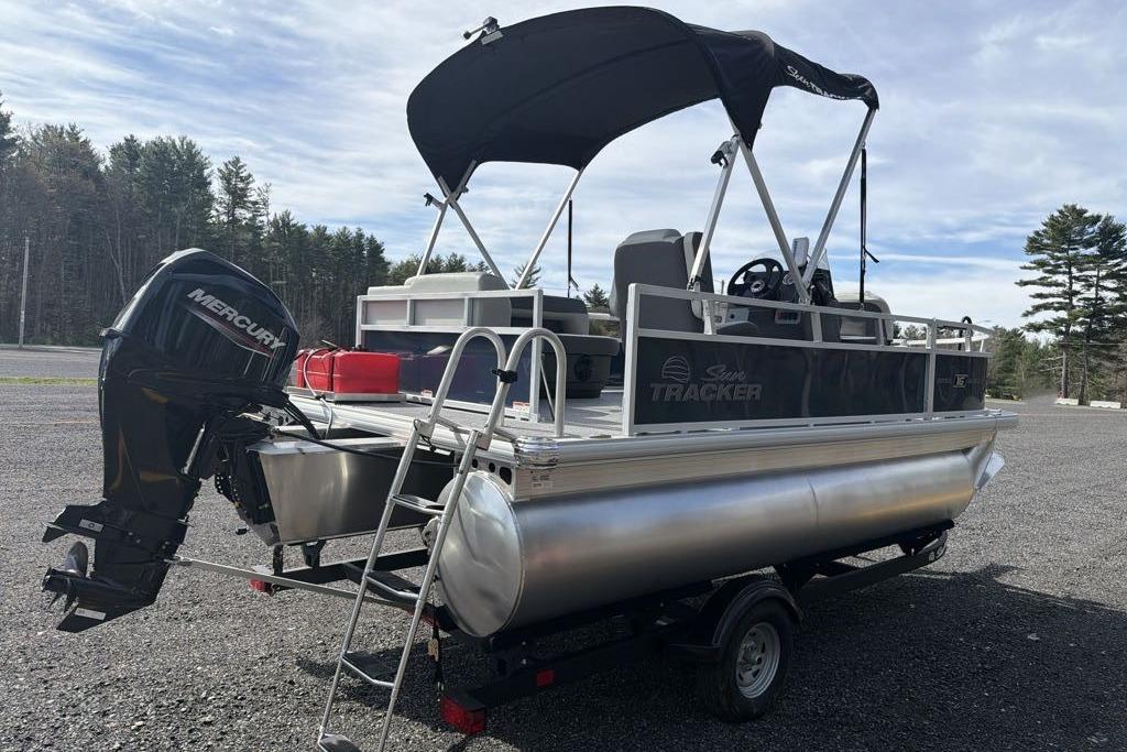 2026 Sun Tracker Bass Buggy 16 XL Select pontoon boat with Mercury outboard motor.
