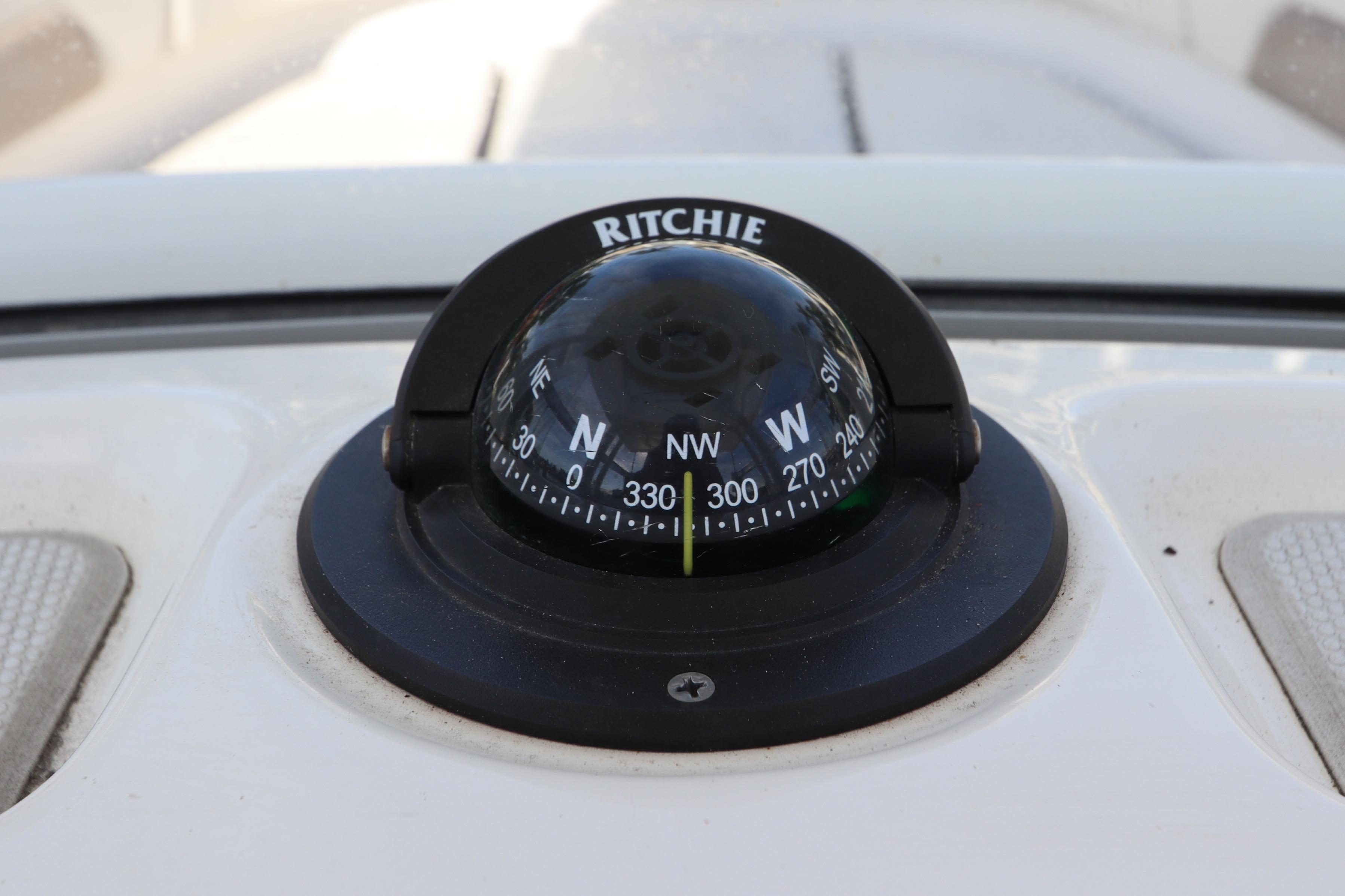 Compass on 2019 Robalo R242 Center Console boat dashboard.