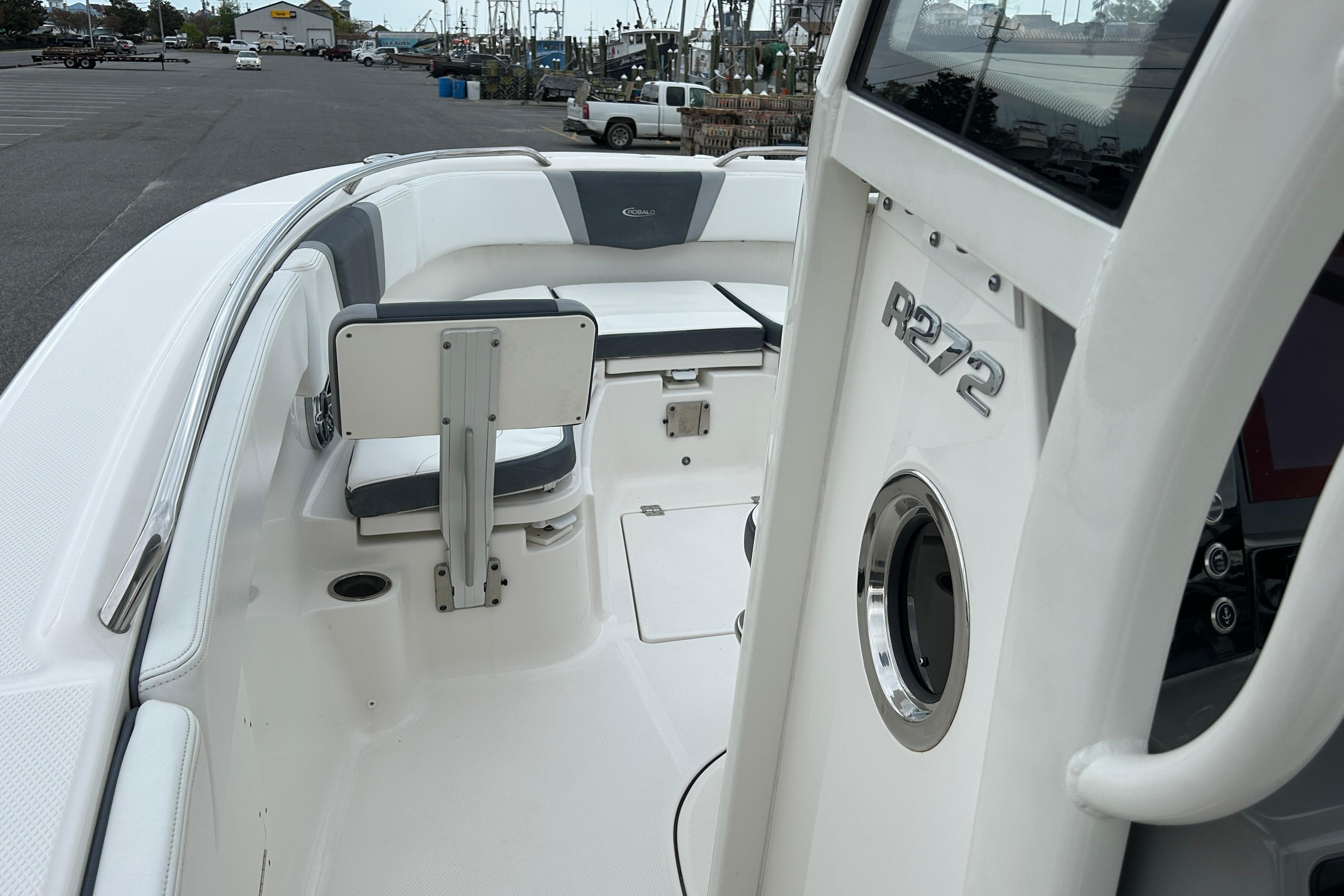 2021 Robalo R272 Center Console boat interior with seating and console details.