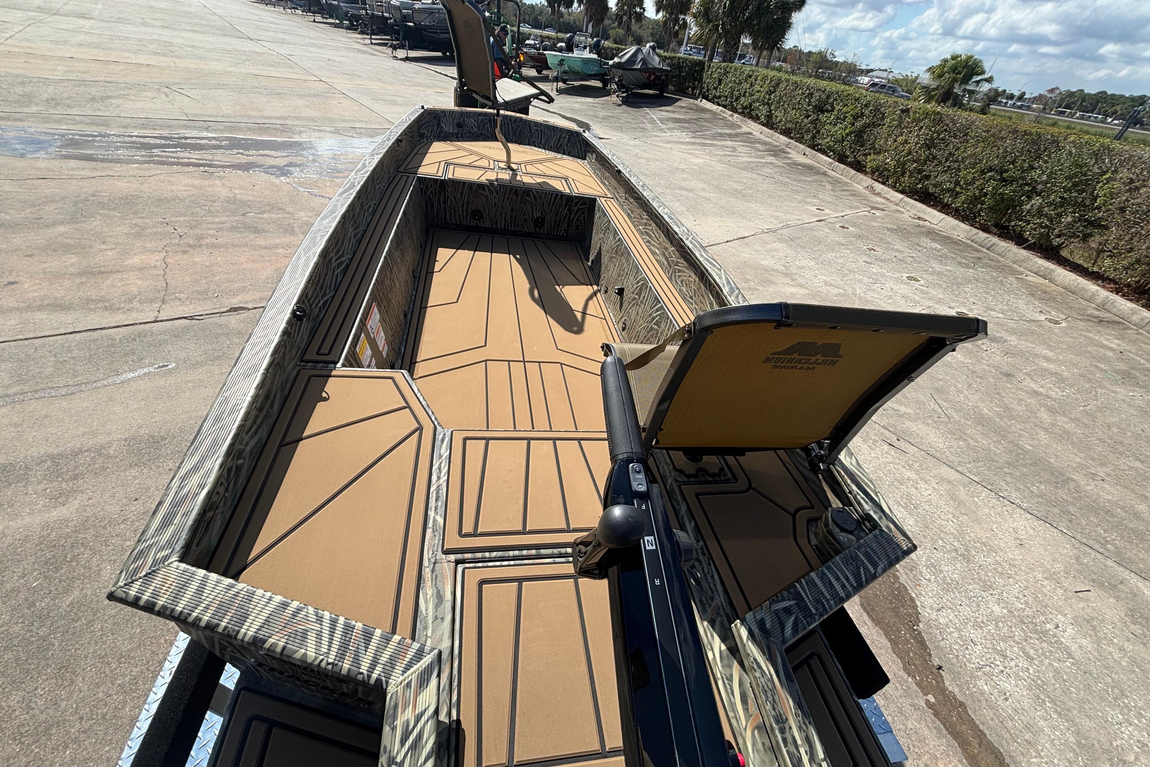2026 Tracker Grizzly 1650 T Prairie Wings Edition boat with spacious interior and camouflage design.