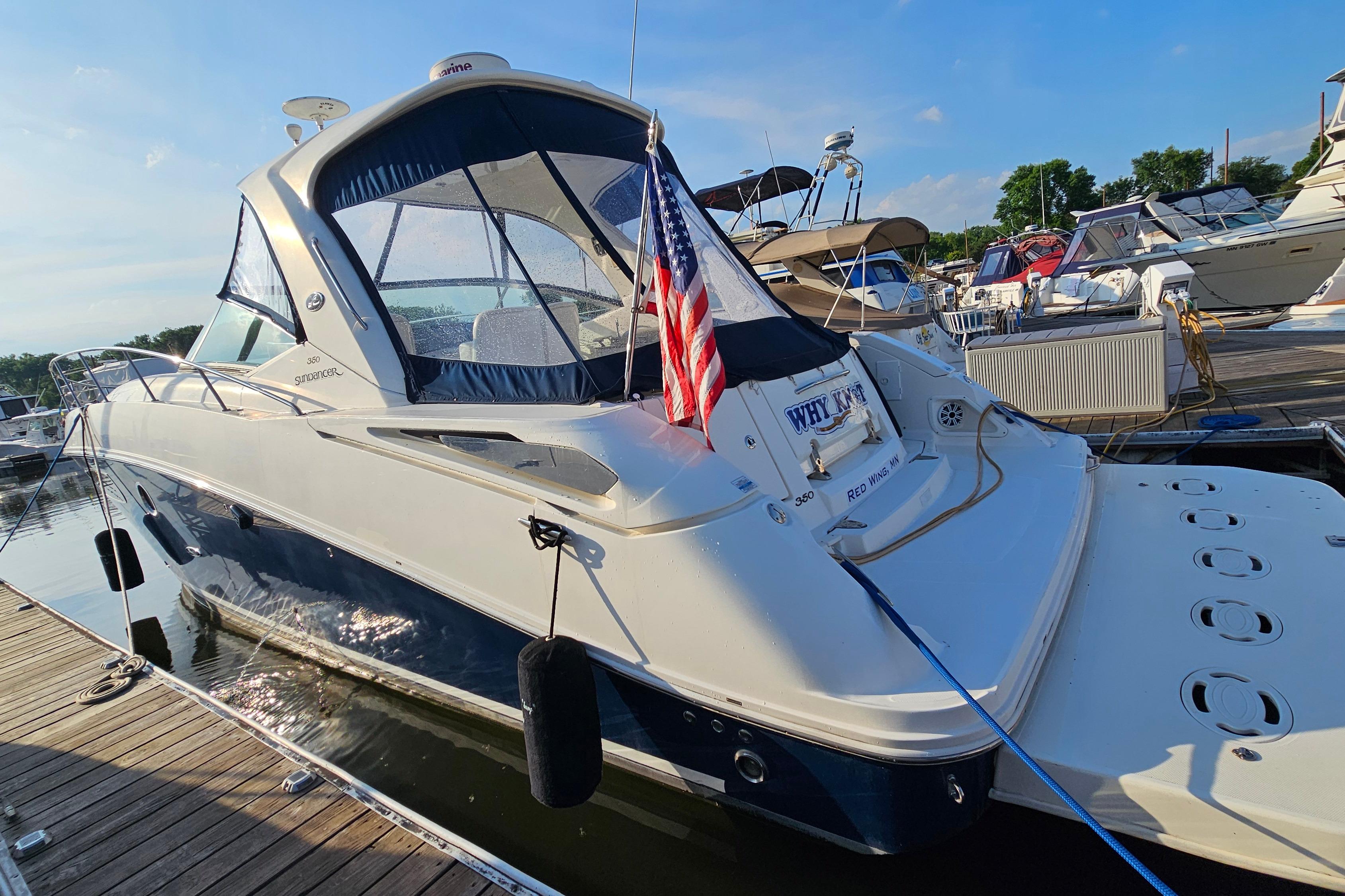 2008 Sea Ray Sundancer 350 docked, featuring sleek design and American flag.