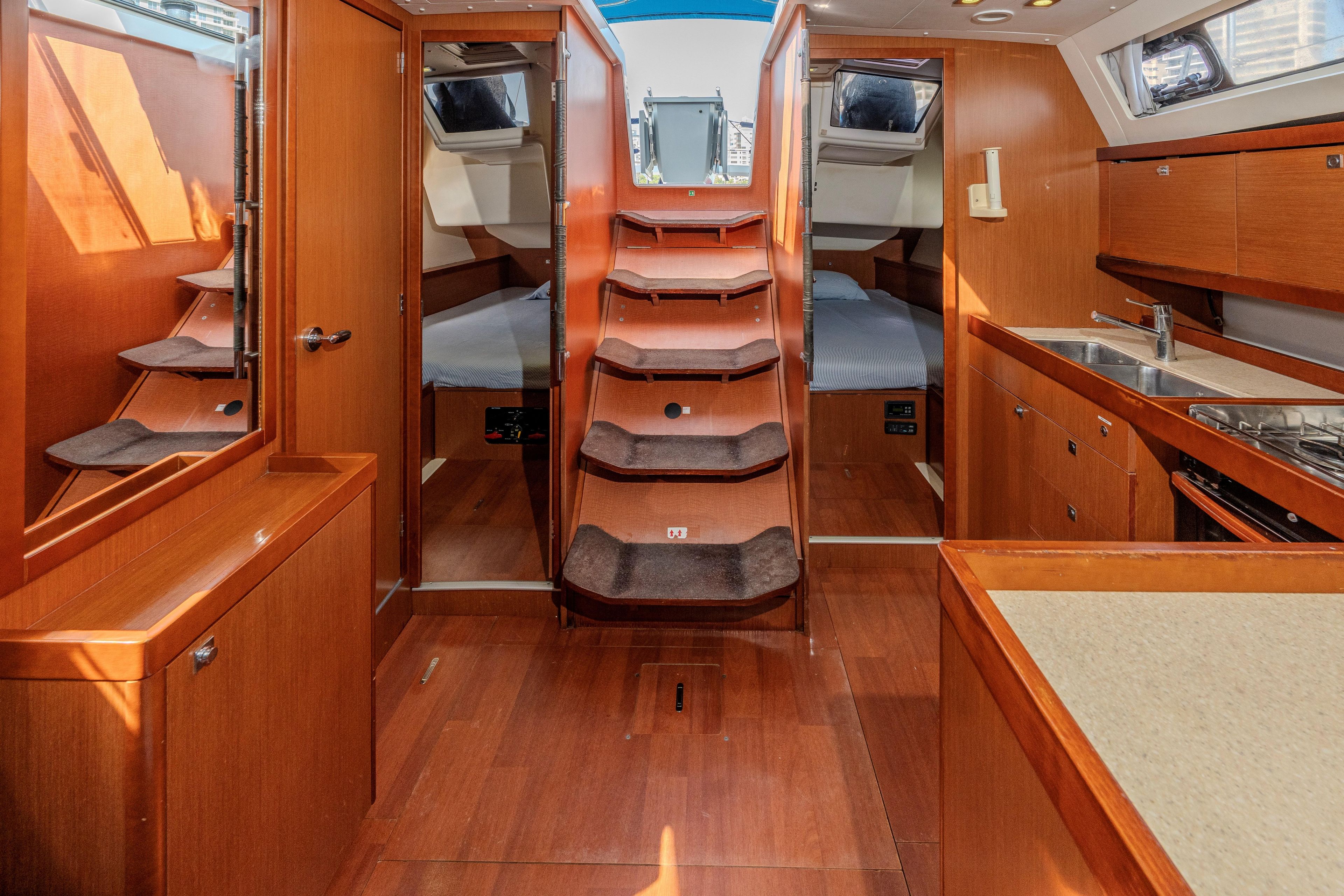 Interior of 2013 Beneteau Oceanis 41 yacht with wooden finish and modern amenities.