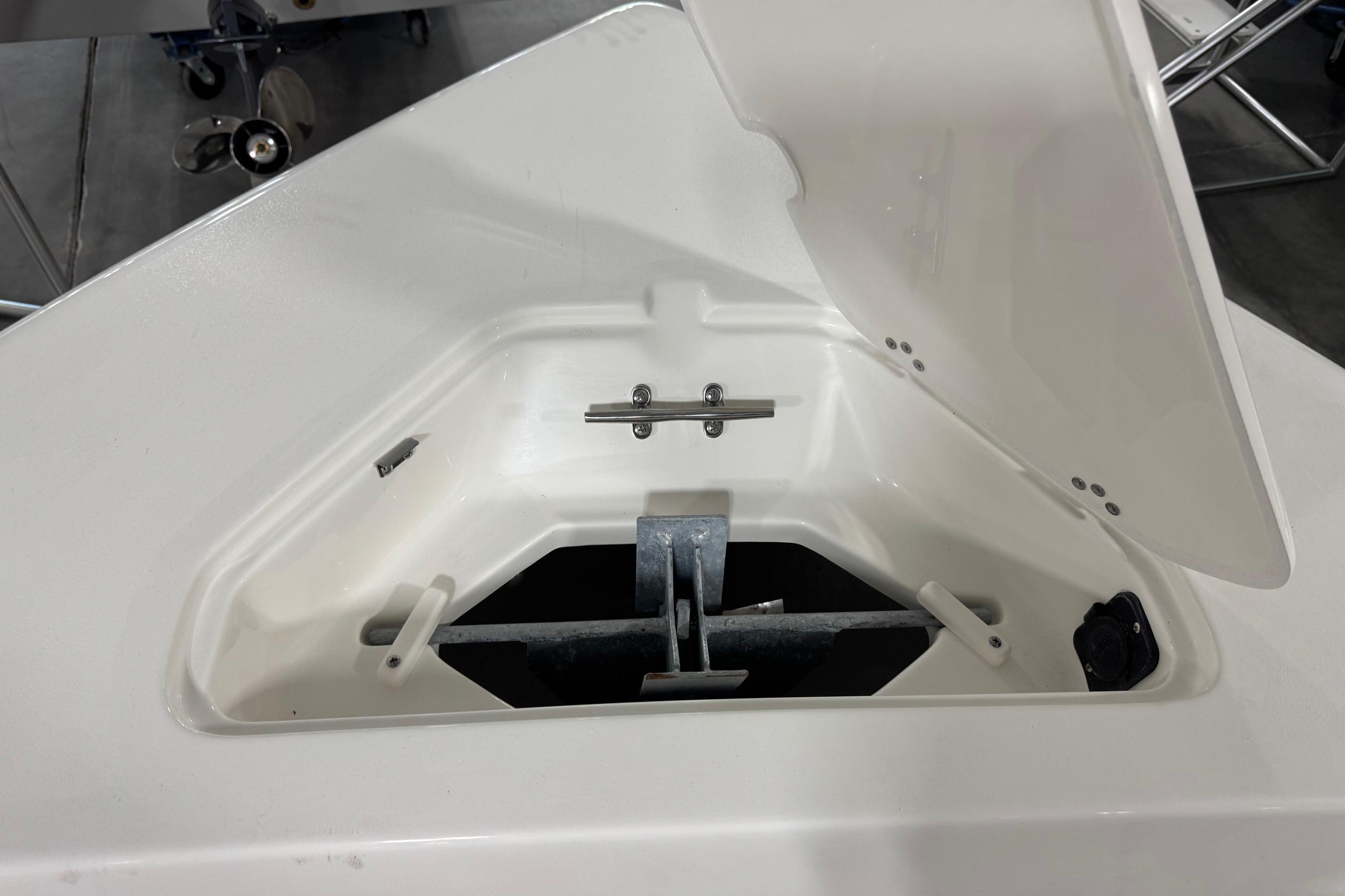 Open anchor compartment of 2026 Key West 203 FS boat, showcasing storage design.