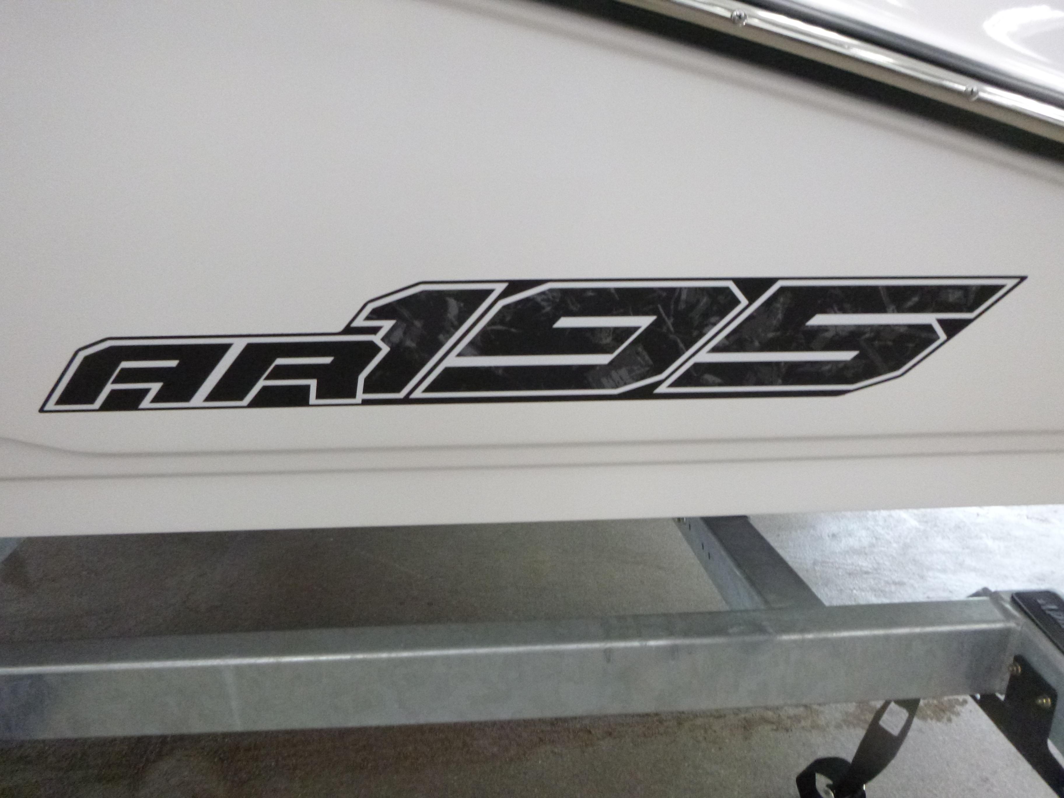 2025 Yamaha Boats AR195 logo on boat hull, featuring bold black lettering.