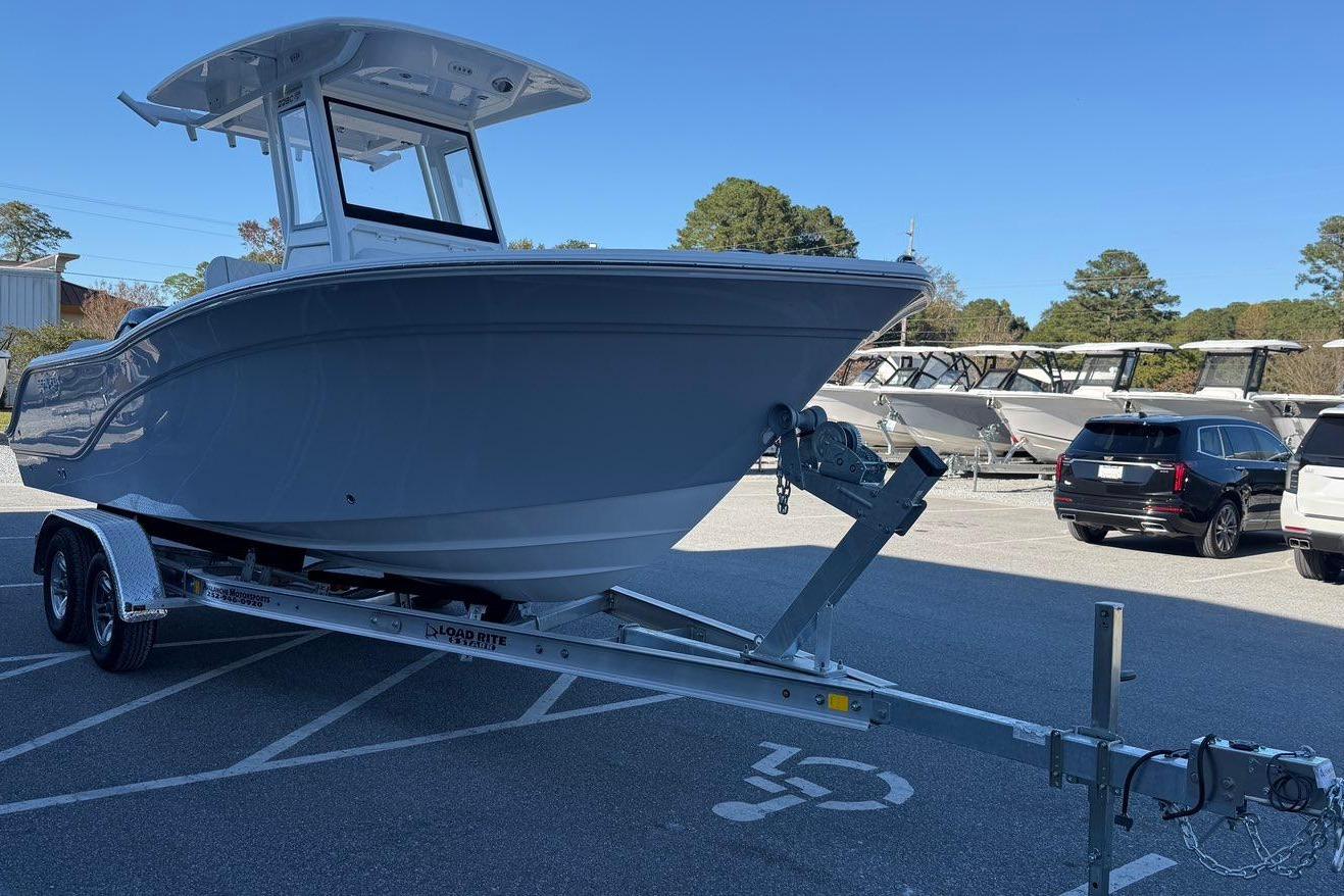 2026 Sea Fox 228 Commander boat on trailer in parking lot.