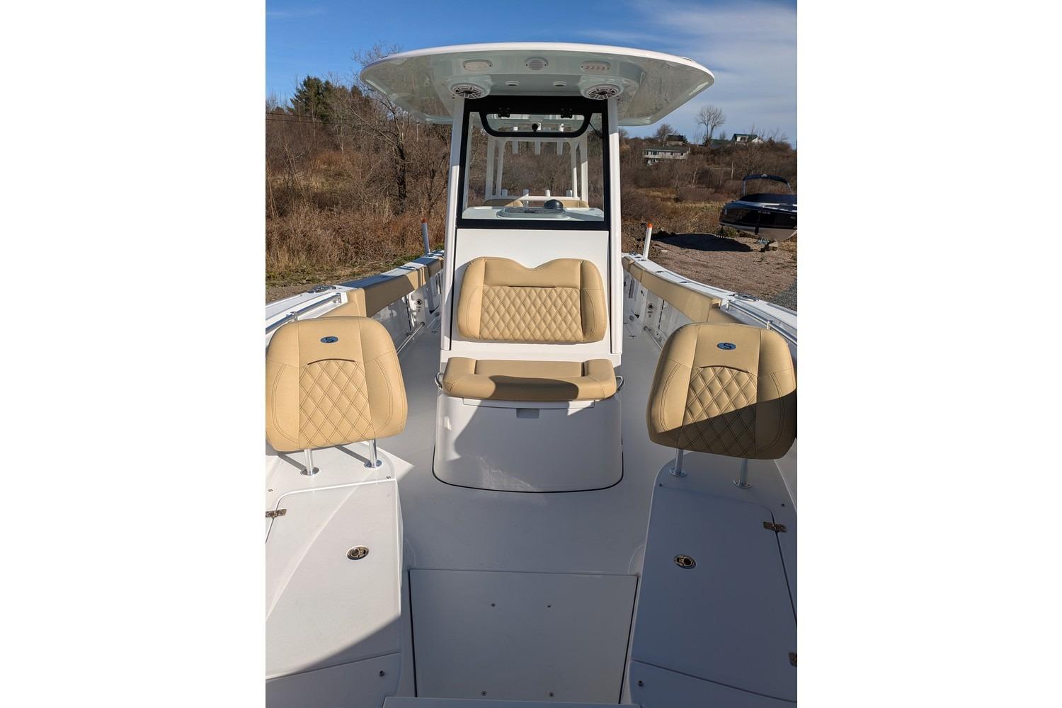 2025 Sportsman Open 282 Center Console boat with tan seating and sleek design.