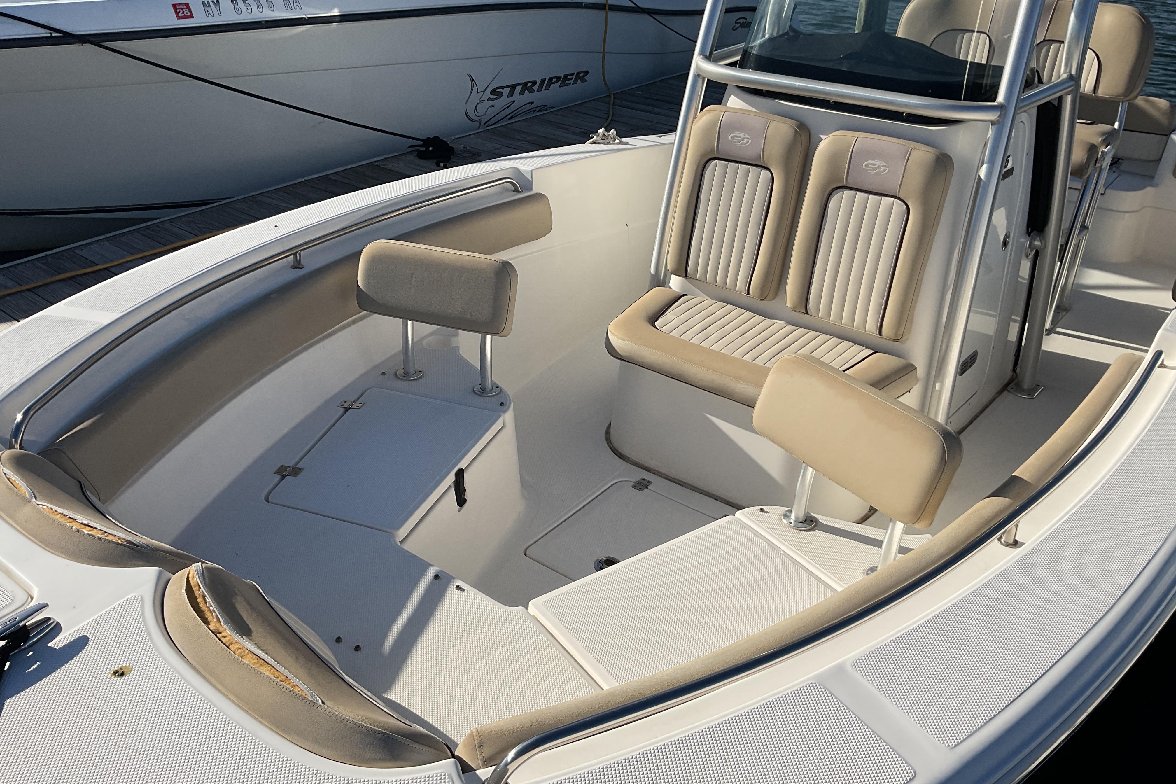 2016 Sea Fox 226 Commander boat interior with beige seating and console.