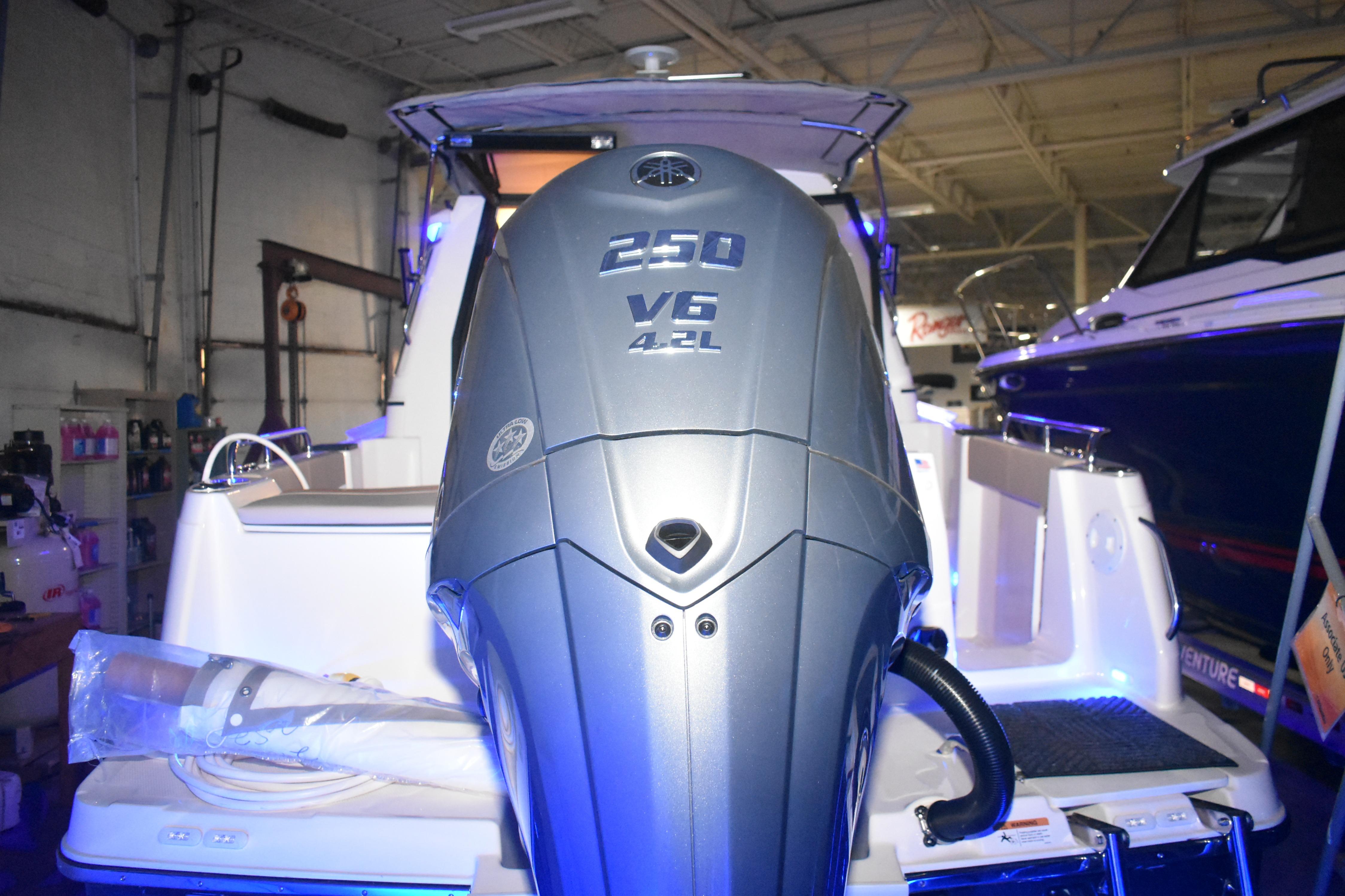 2026 Cutwater C-248 Coupe with Yamaha 250 V6 engine in a showroom.