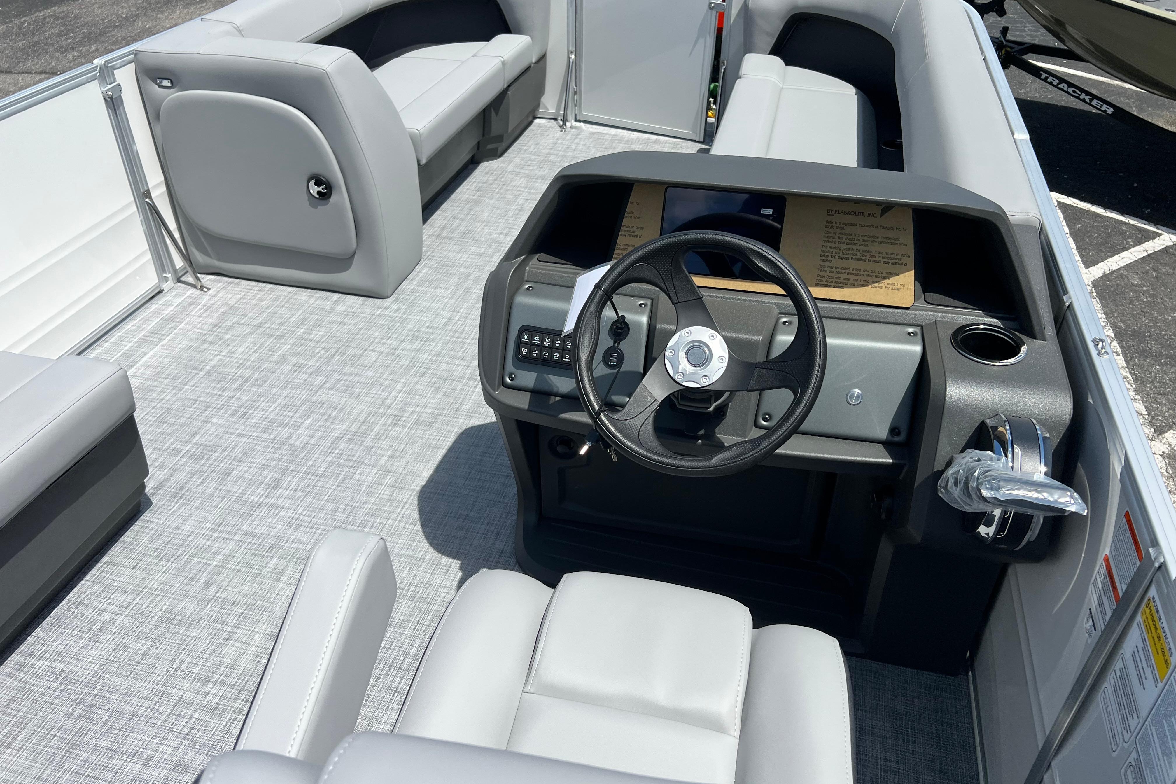 2026 Sun Tracker Party Barge 18 DLX interior with steering console and seating.