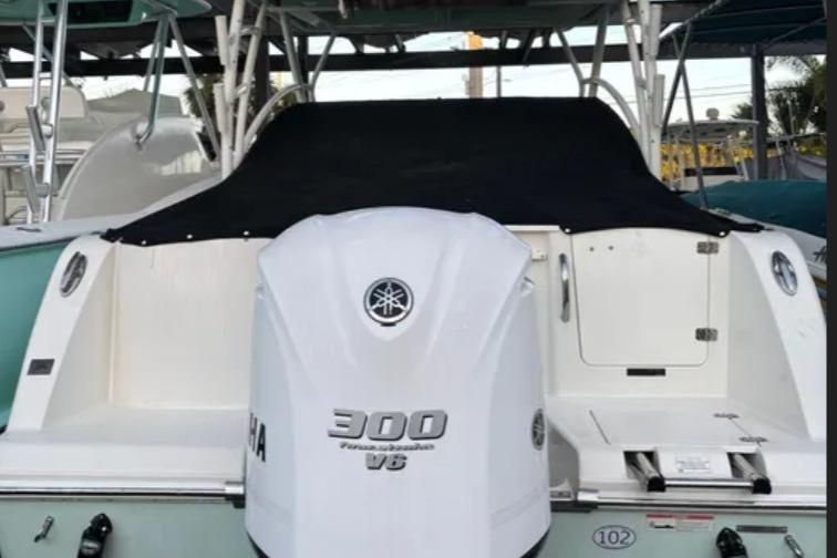 2019 Sailfish 275 DC boat with Yamaha 300 V6 engine, rear view.