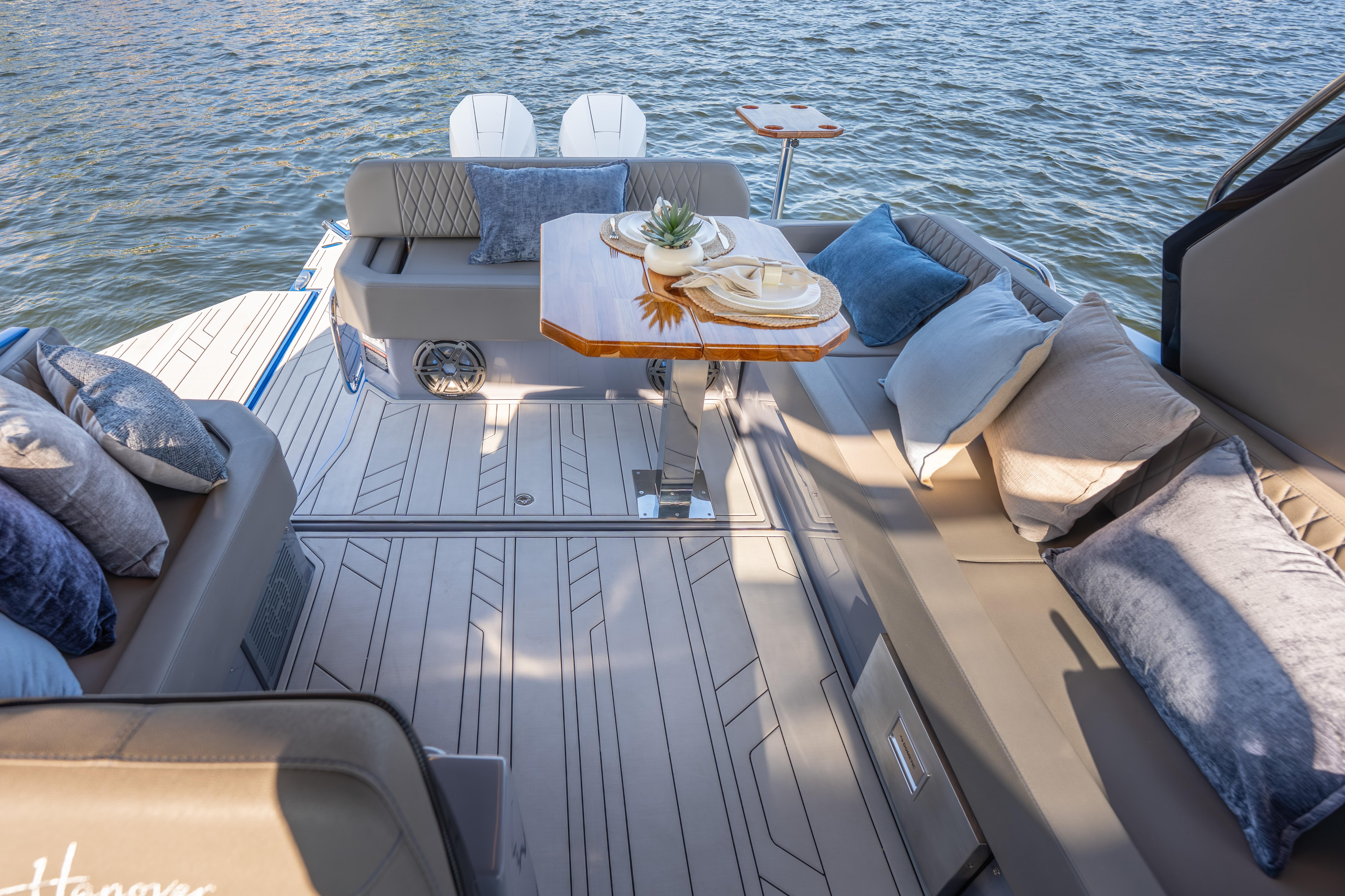 Luxurious 2026 Hanover 347 boat interior with elegant seating and stylish decor on the water.