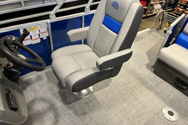 Captain's chair on 2026 Sun Tracker Party Barge 20 DLX pontoon boat, featuring gray and blue upholstery.