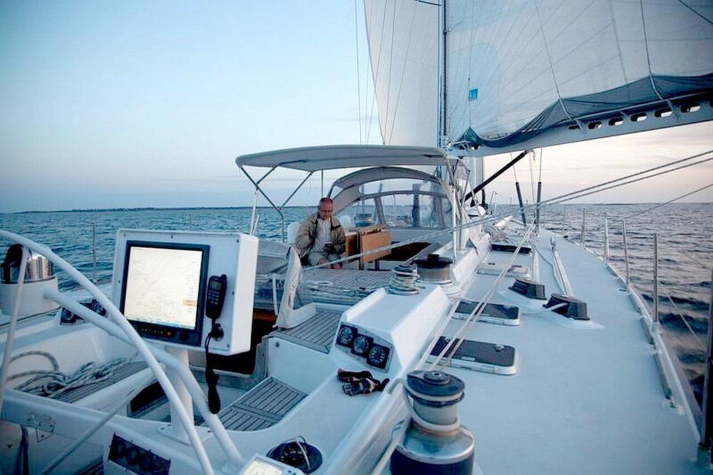 Sailing on a 1983 VATON 78 Sloop yacht with modern navigation equipment.