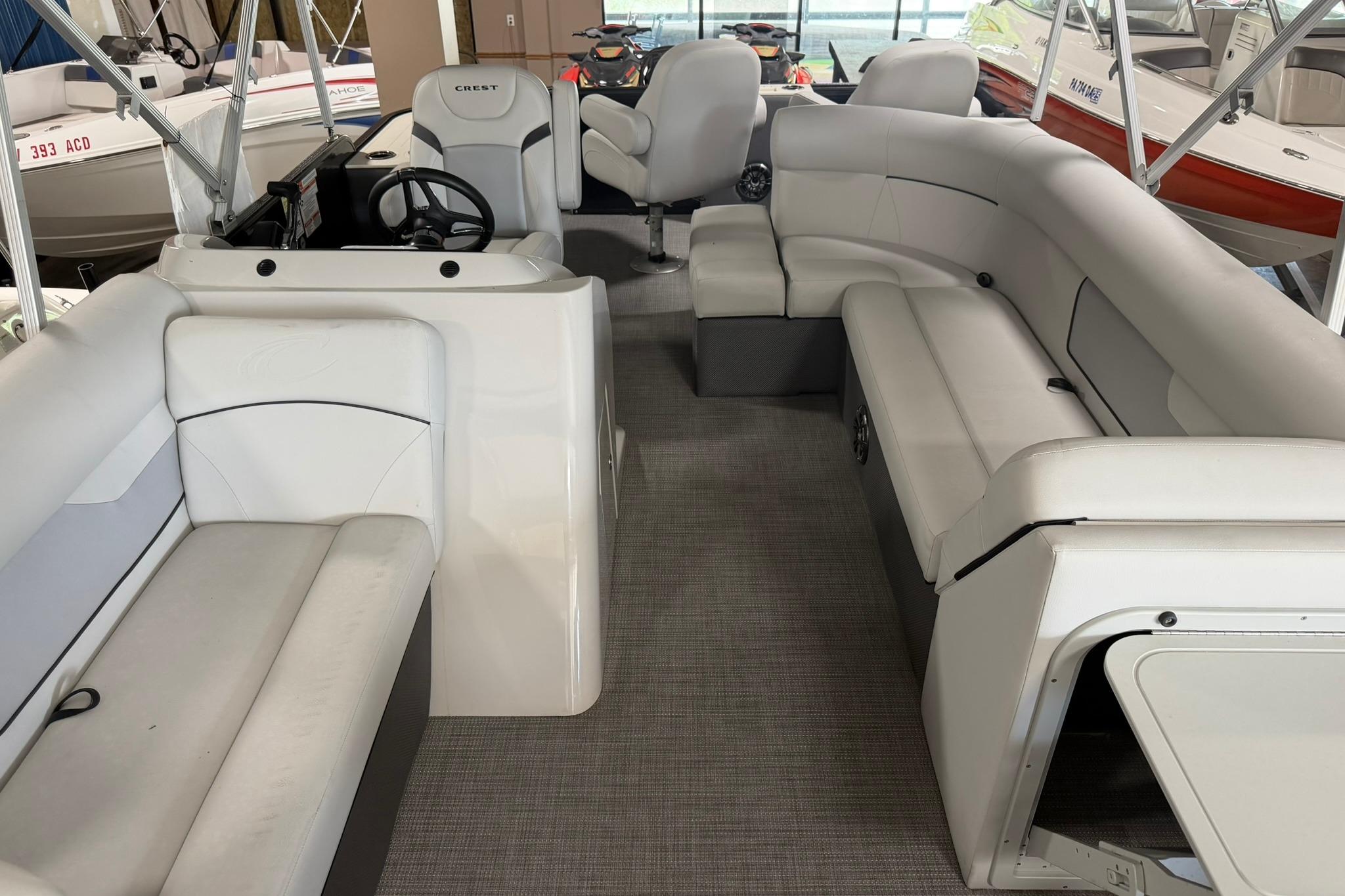 2023 Crest Classic LX 200 pontoon boat interior with spacious seating and modern helm.