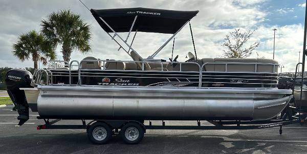 2023 Sun Tracker SportFish 22 XP3 pontoon boat on trailer.