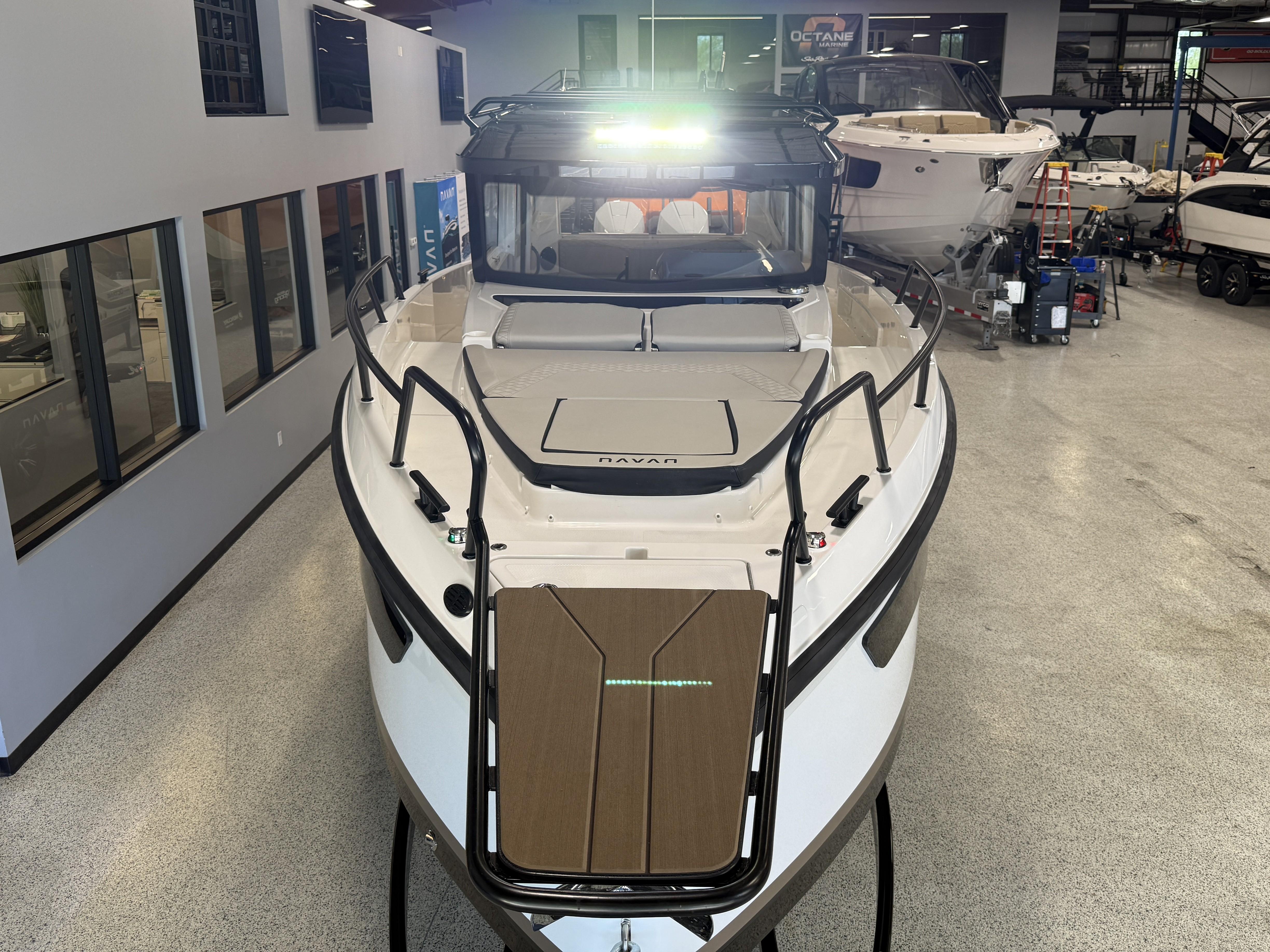 2025 Navan C30 boat in showroom, front view with sleek design and modern features.