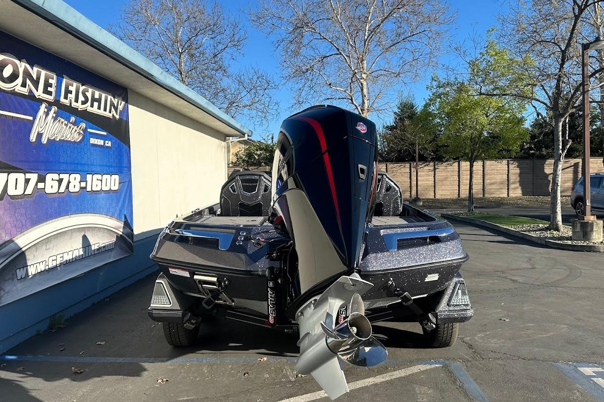 2026 Ranger Z521R Garmin Cup-Equipped boat parked outside a marine shop.