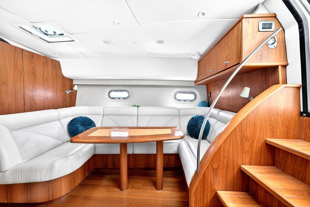Luxurious interior of 2006 Tiara Yachts 4300 Sovran with elegant wood finish and plush seating.