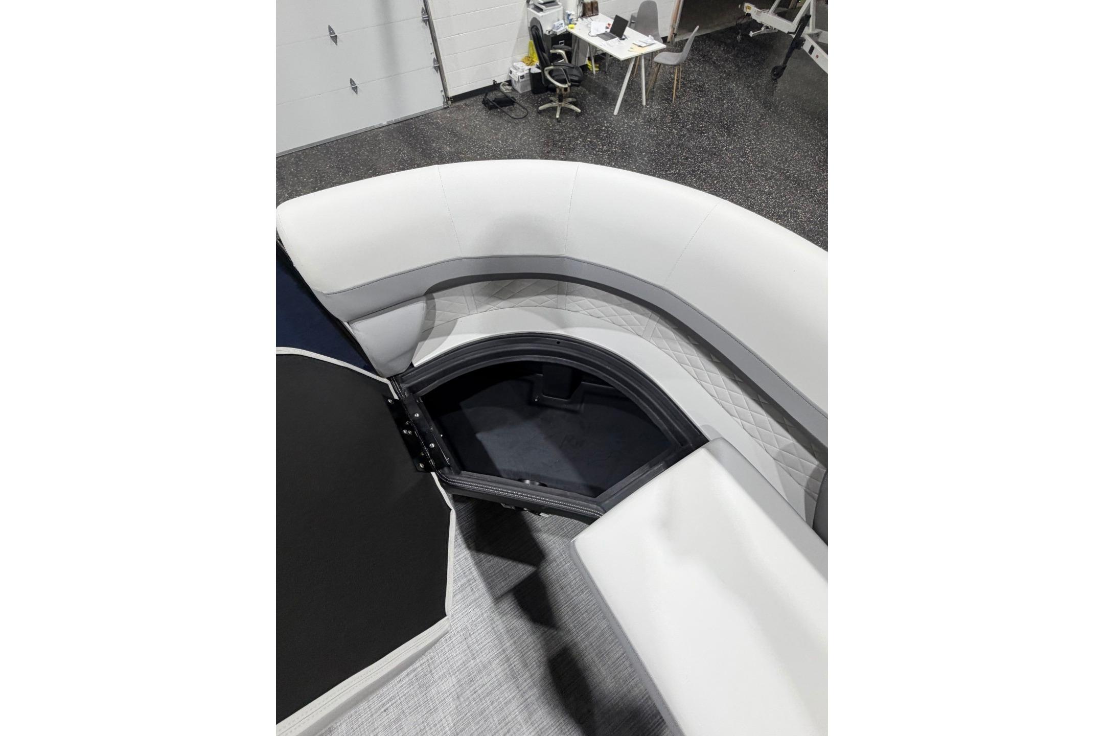 2026 Lowe SS 230 WT boat interior with curved seating and storage compartment.