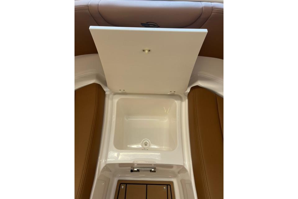 Interior storage compartment of 2025 Chaparral 247 SSX boat, featuring sleek design.