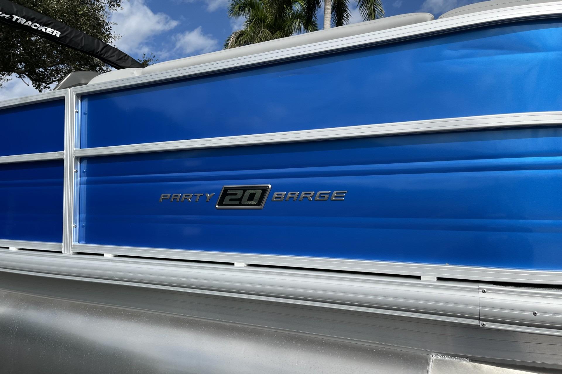 2026 Sun Tracker Party Barge 20 DLX pontoon boat with blue exterior.