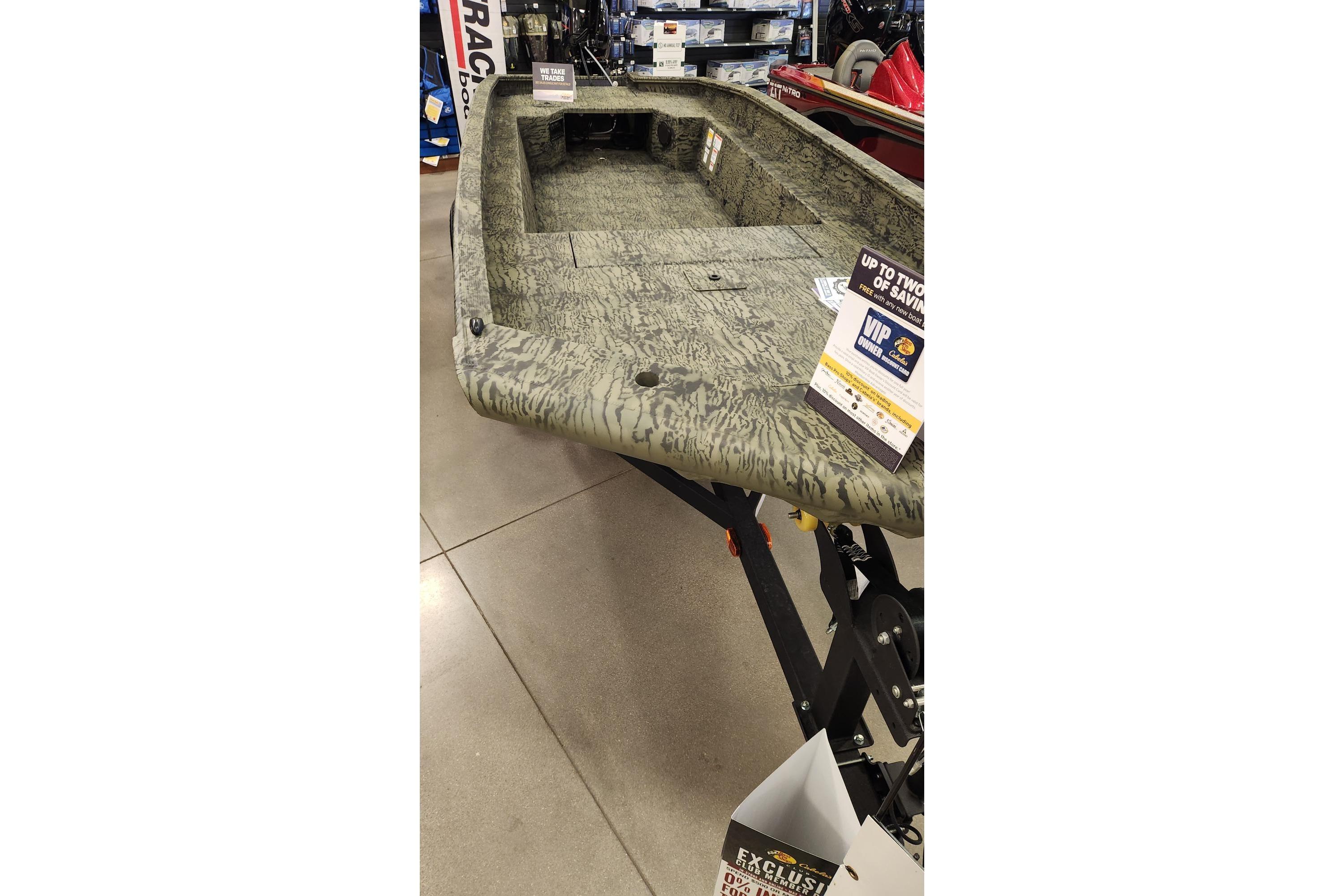 2025 Tracker Grizzly 1650 T Prairie Wings Edition boat on display in showroom.
