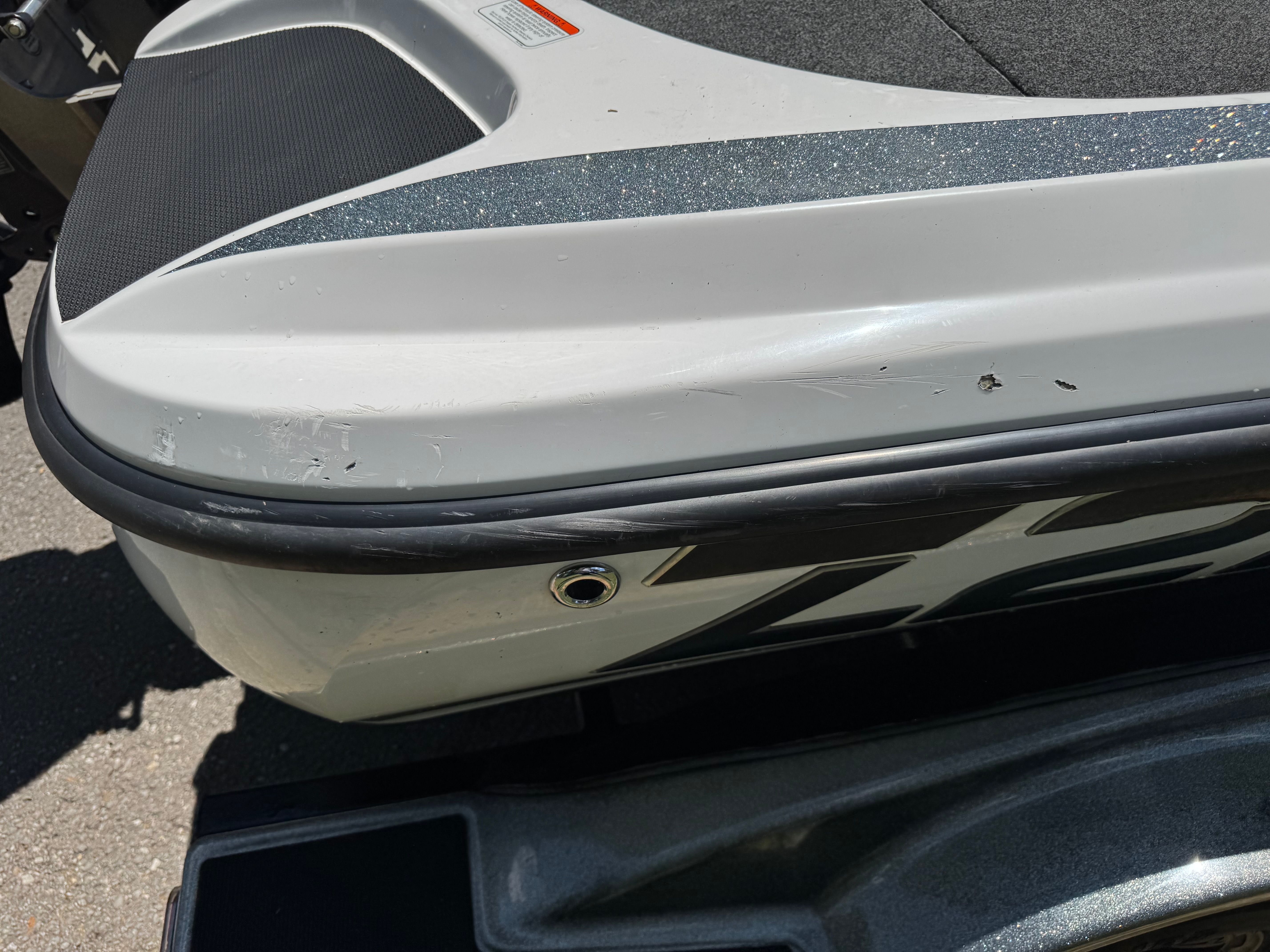 Close-up of a 2019 Nitro Z21 boat with scratches.