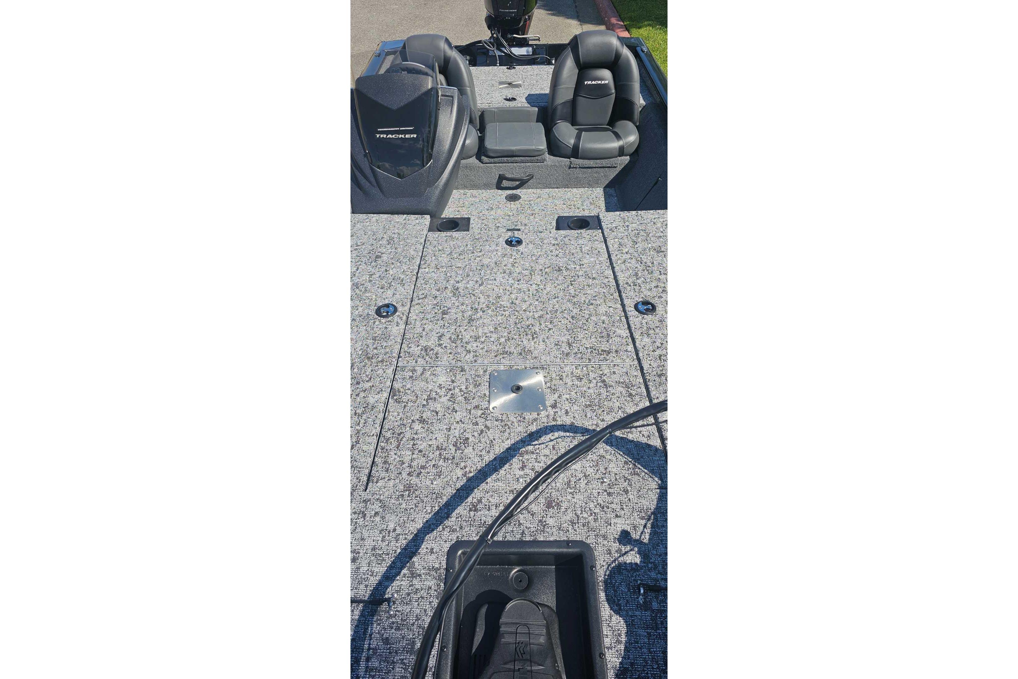 2026 Tracker Pro Team 190 boat interior with gray carpet and seating.