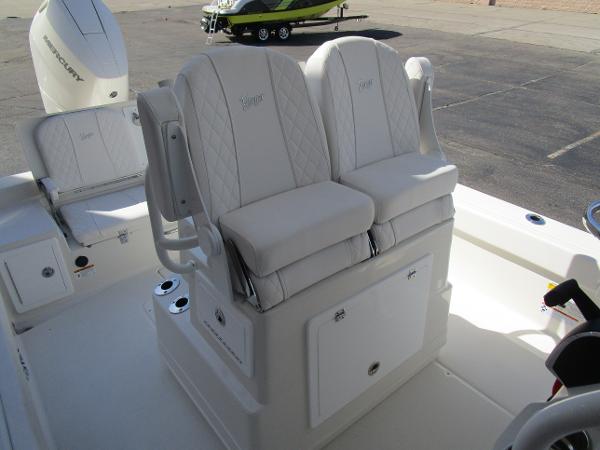 2024 Ranger 2660 Bay boat with dual cushioned seats and storage compartment.