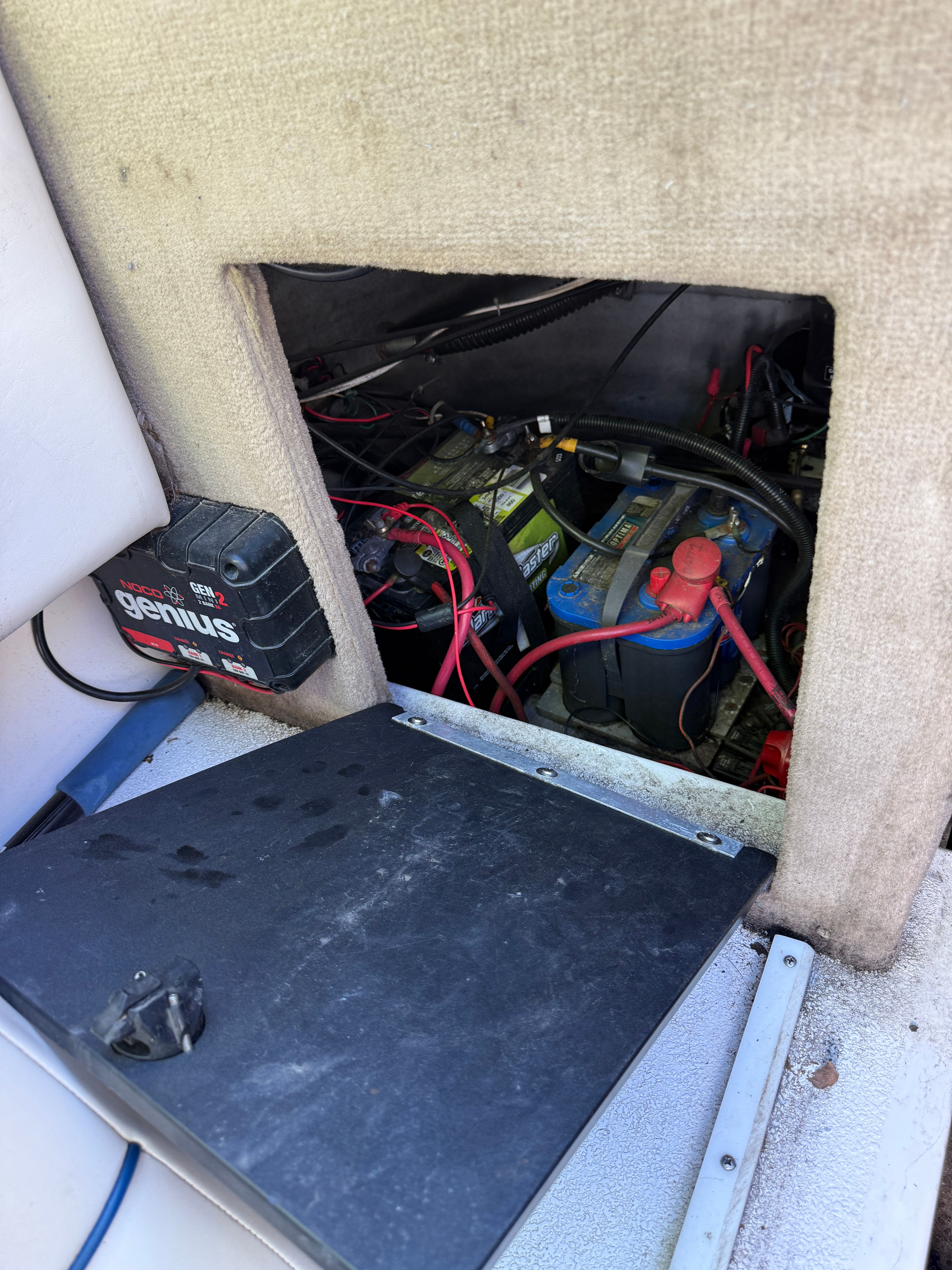 Battery compartment of a 1999 Custom 2335 Cuddy Cabin boat.