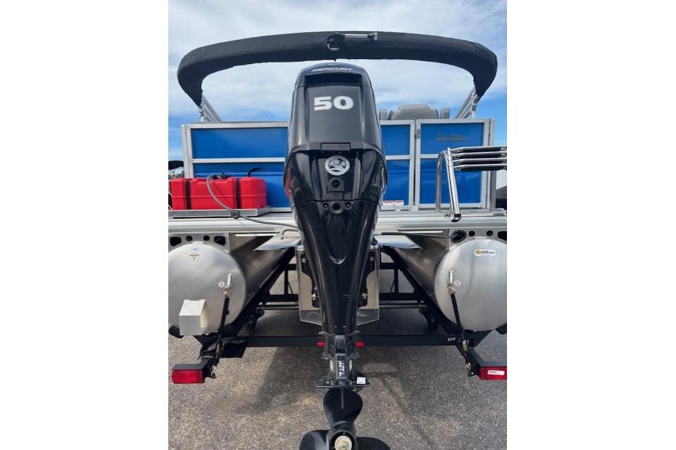 2026 Sun Tracker Party Barge 16 DLX with Mercury 50 outboard motor, rear view.