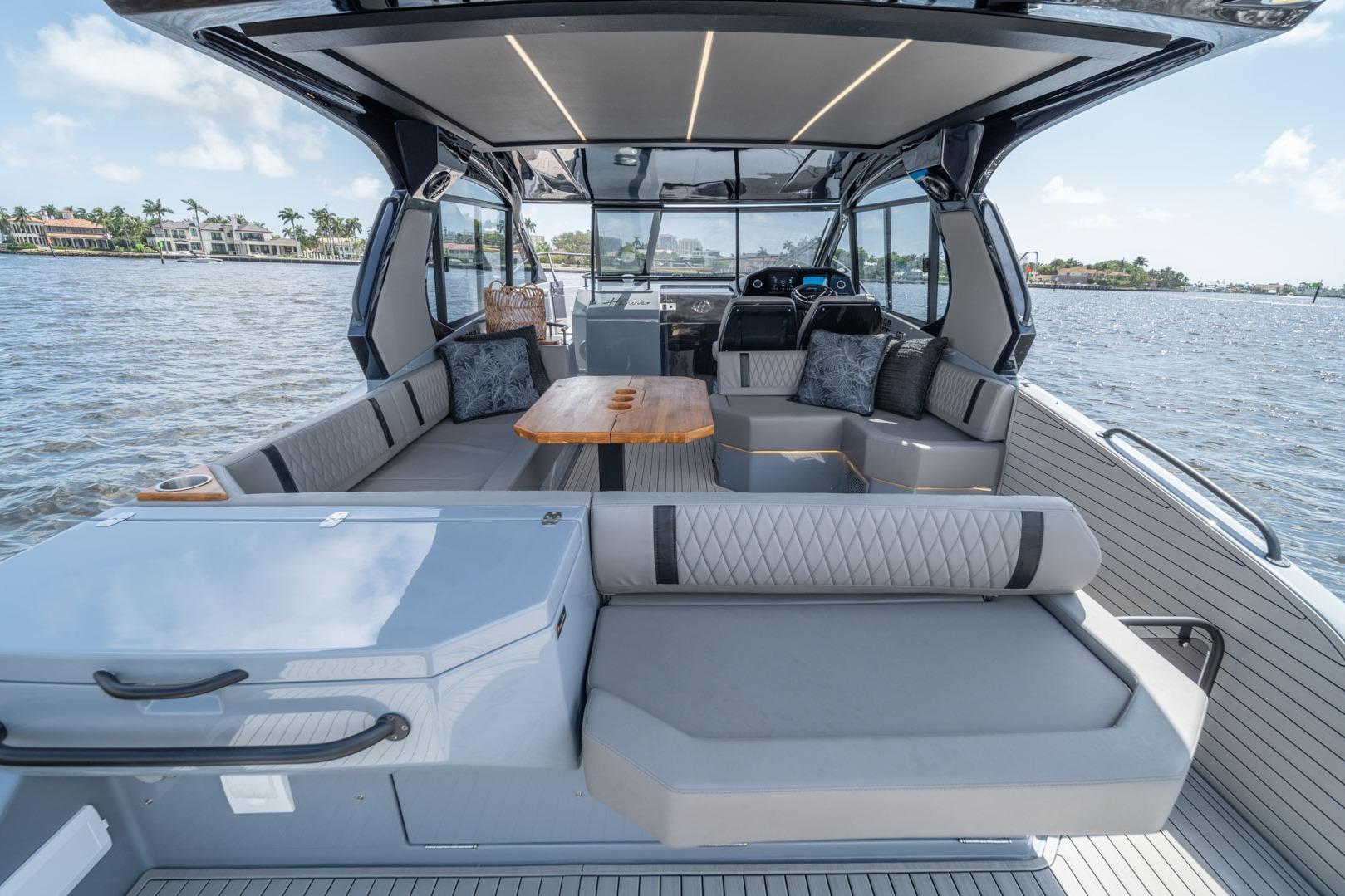 Luxurious 2026 Hanover 387 yacht interior with elegant seating and scenic water view.