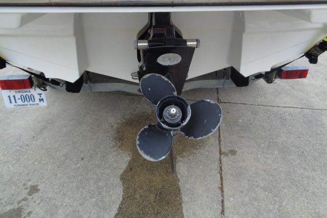 Rear view of 2019 Monterey 218SS Super Sport boat propeller on concrete surface.