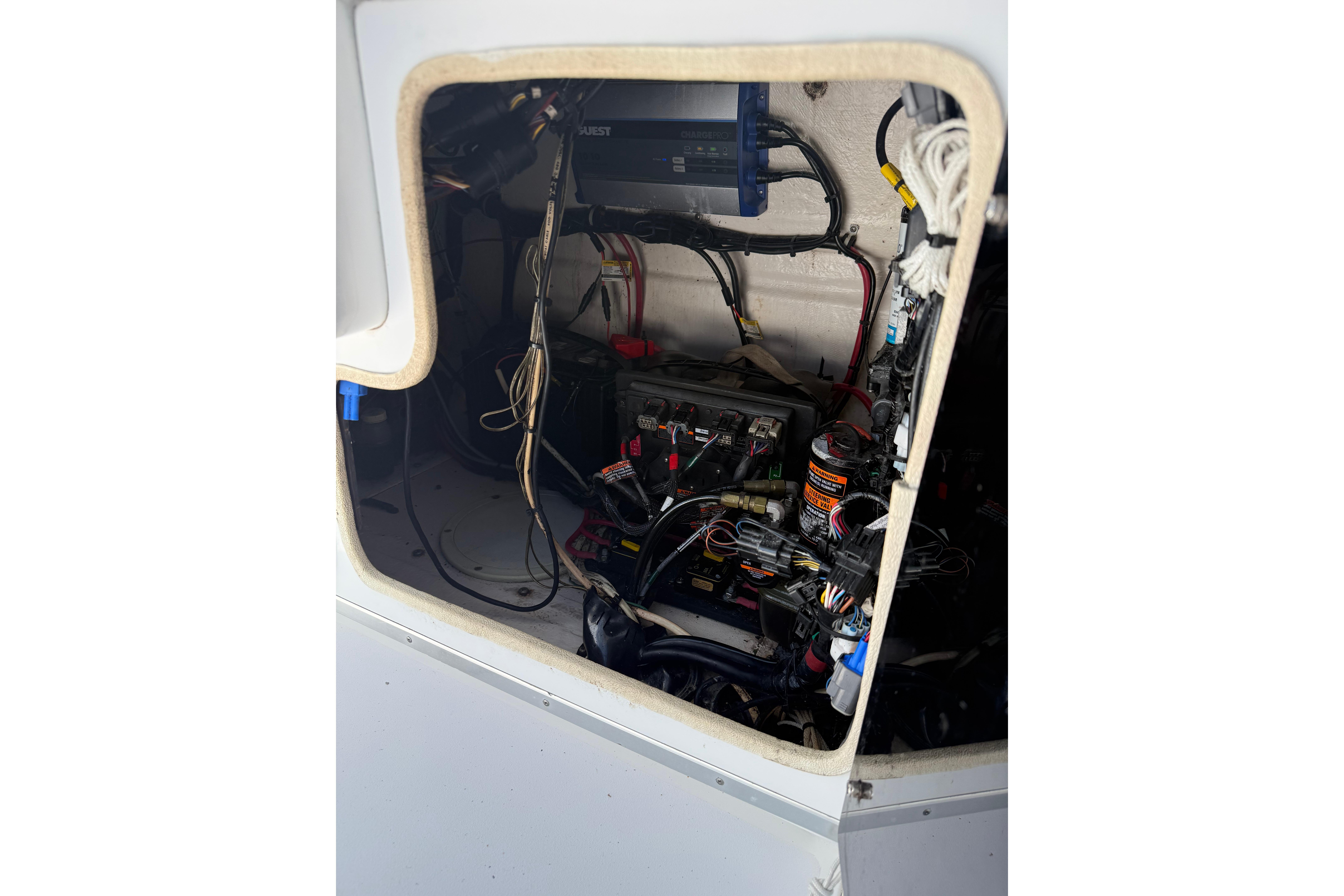Interior view of a 1992 Intrepid 289 Center Console boat's wiring and electrical components.