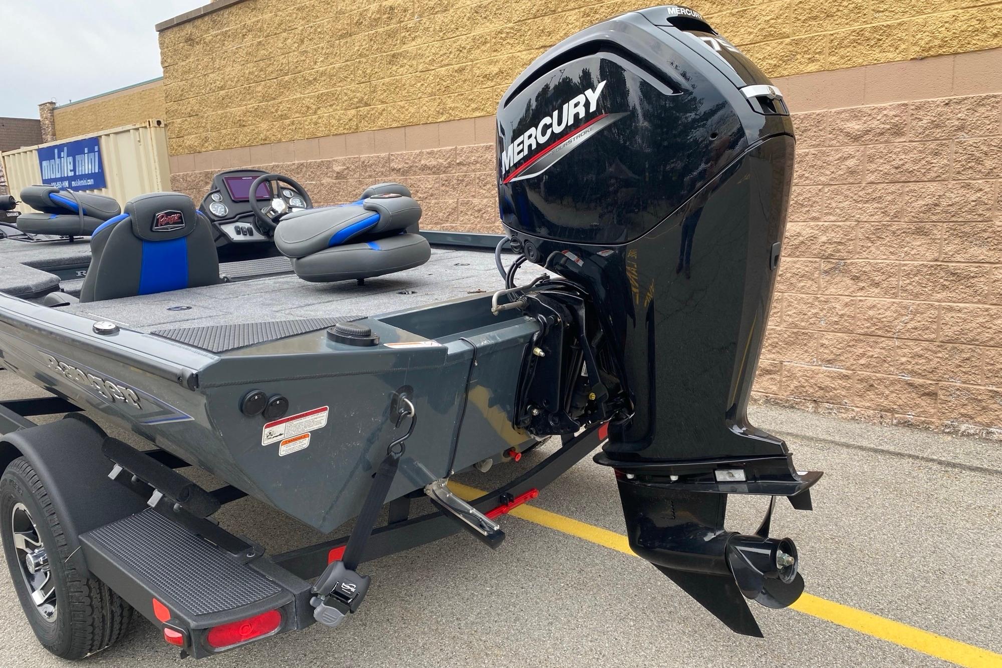 2026 Ranger RT178 boat with Mercury outboard motor, parked on pavement.