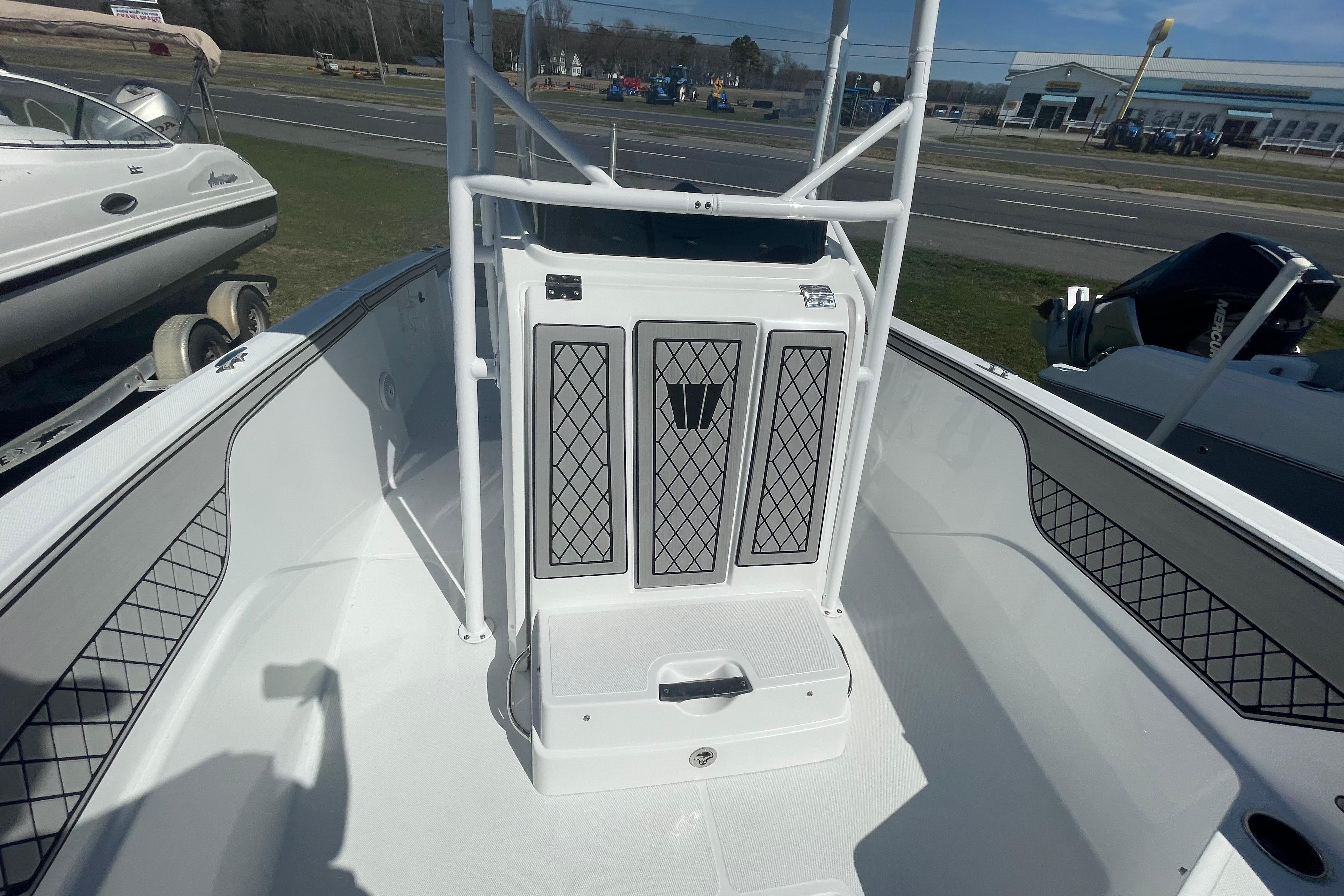 2022 Wellcraft 202 Fisherman boat interior with seating and storage compartments.