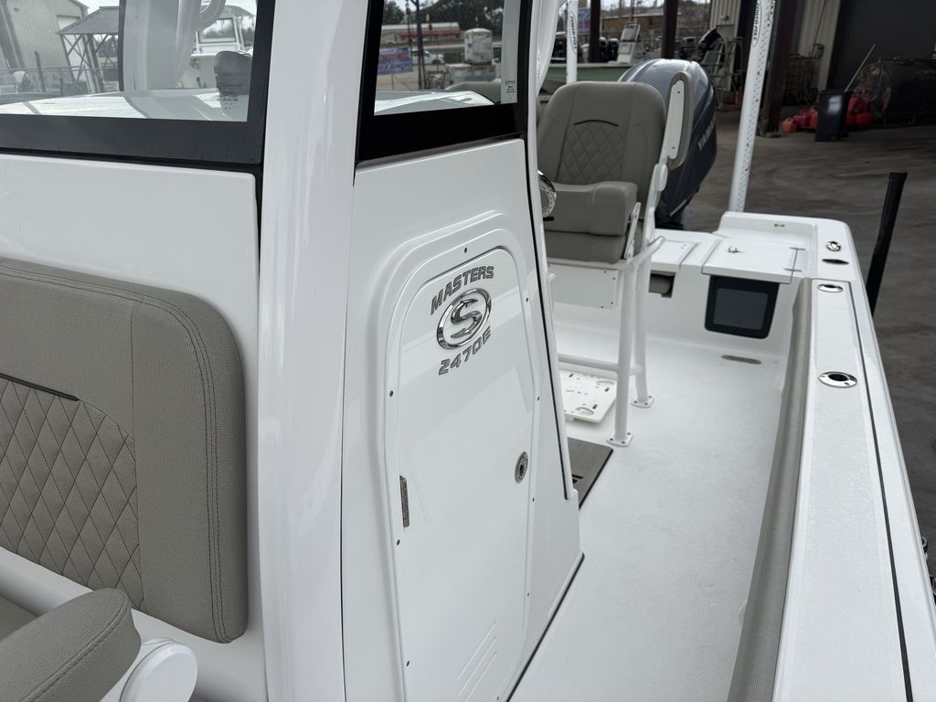 2025 Sportsman Masters 247OE Bay Boat with gray seating and white hull.
