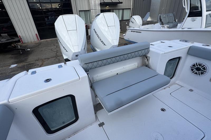 2026 Sportsman Open 282 Center Console boat with dual Mercury engines and foldable seating.